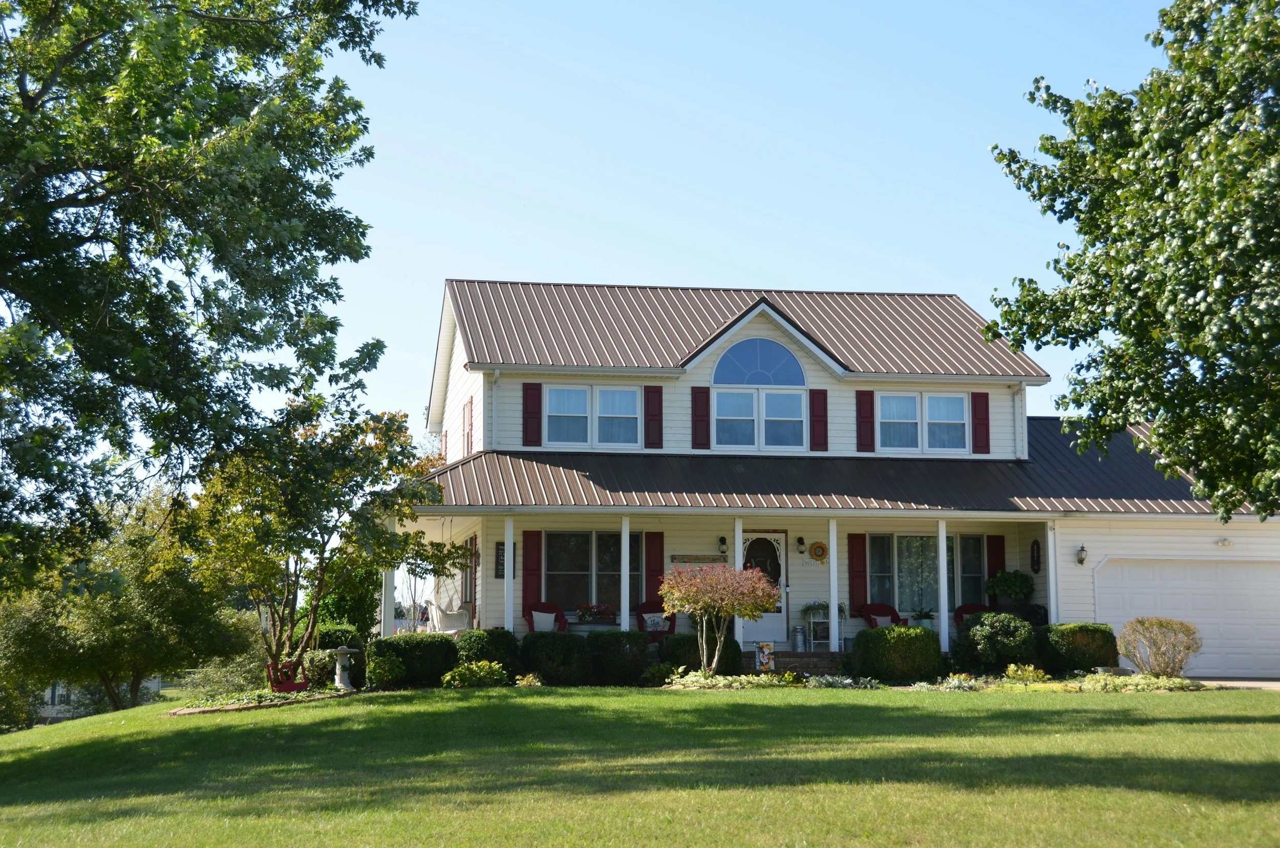 Two-story family home with a front porch, the kind of asset a revocable living trust can pass to heirs without probate