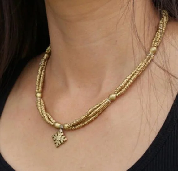 Bullet bead cross necklace