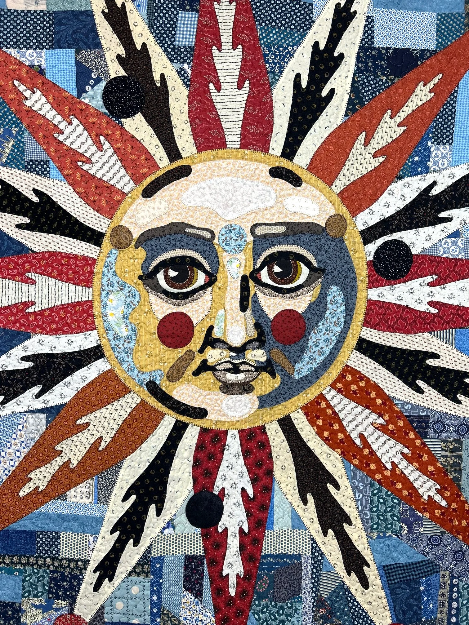 heirloom folk art quilt featuring needle turn applique face