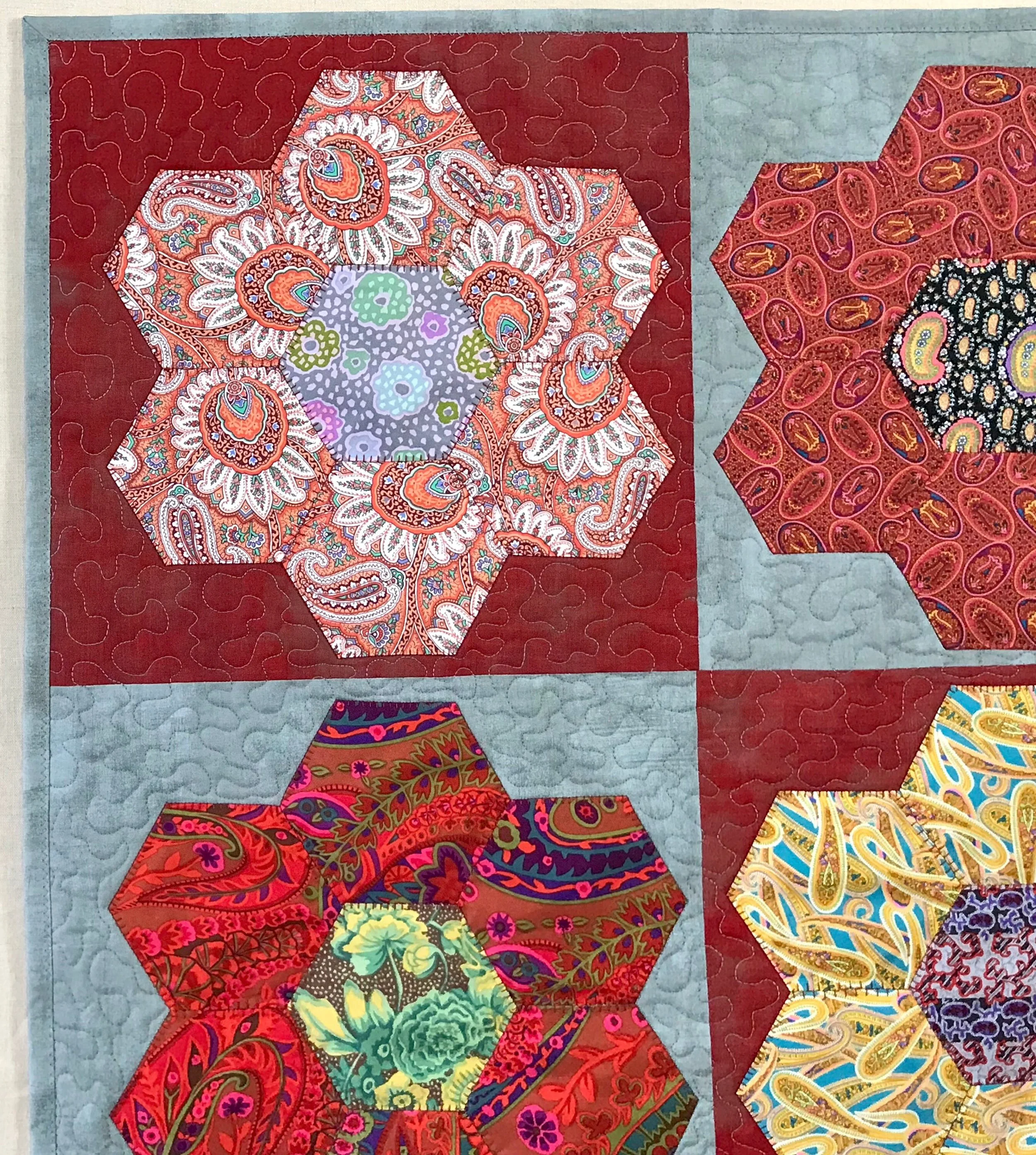 quilted pillow sham in a hexagon flower pattern