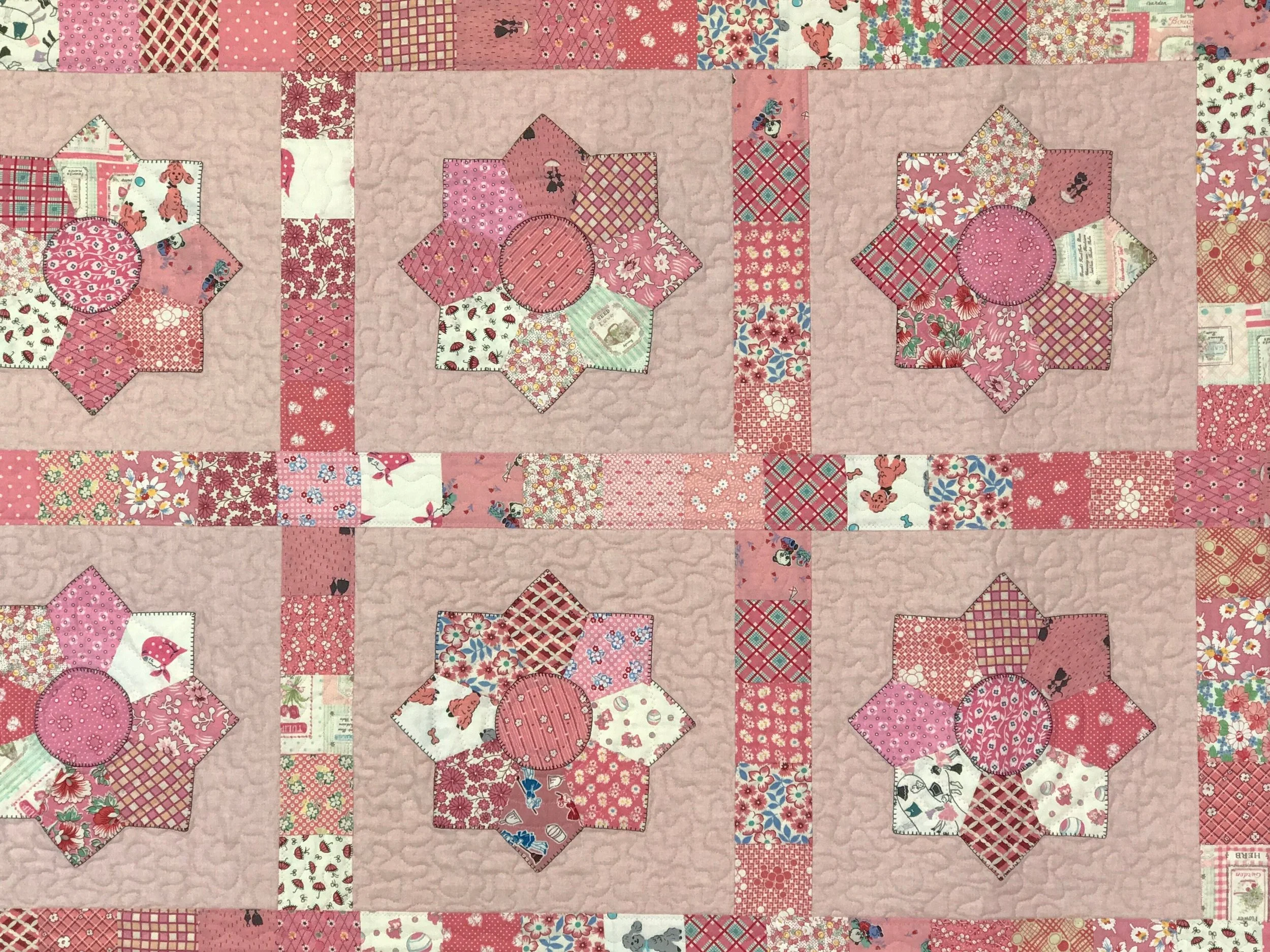 pink girl's quilt in a Dresden plate pattern