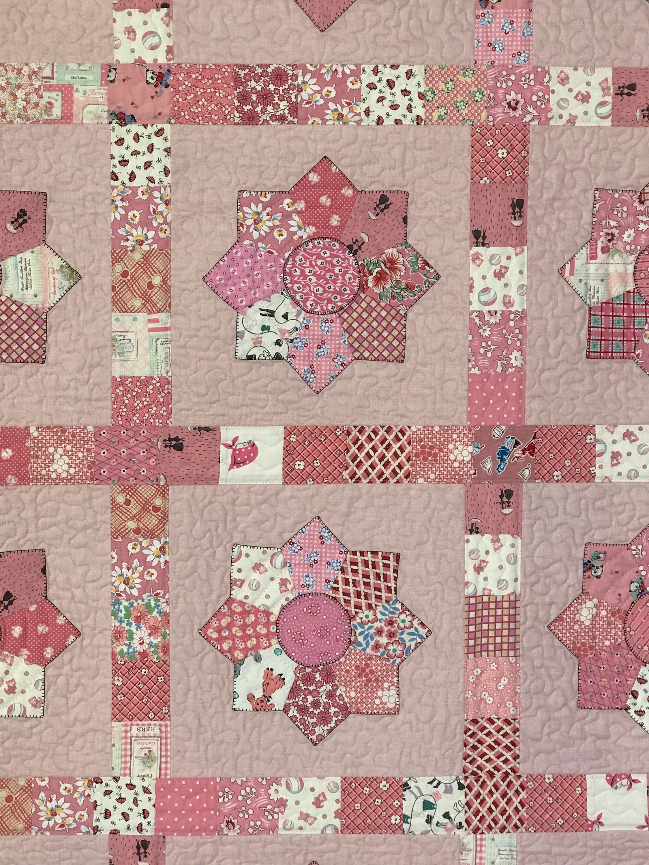 vintage Feedsack quilt in shades of pink for a girl's twin bed