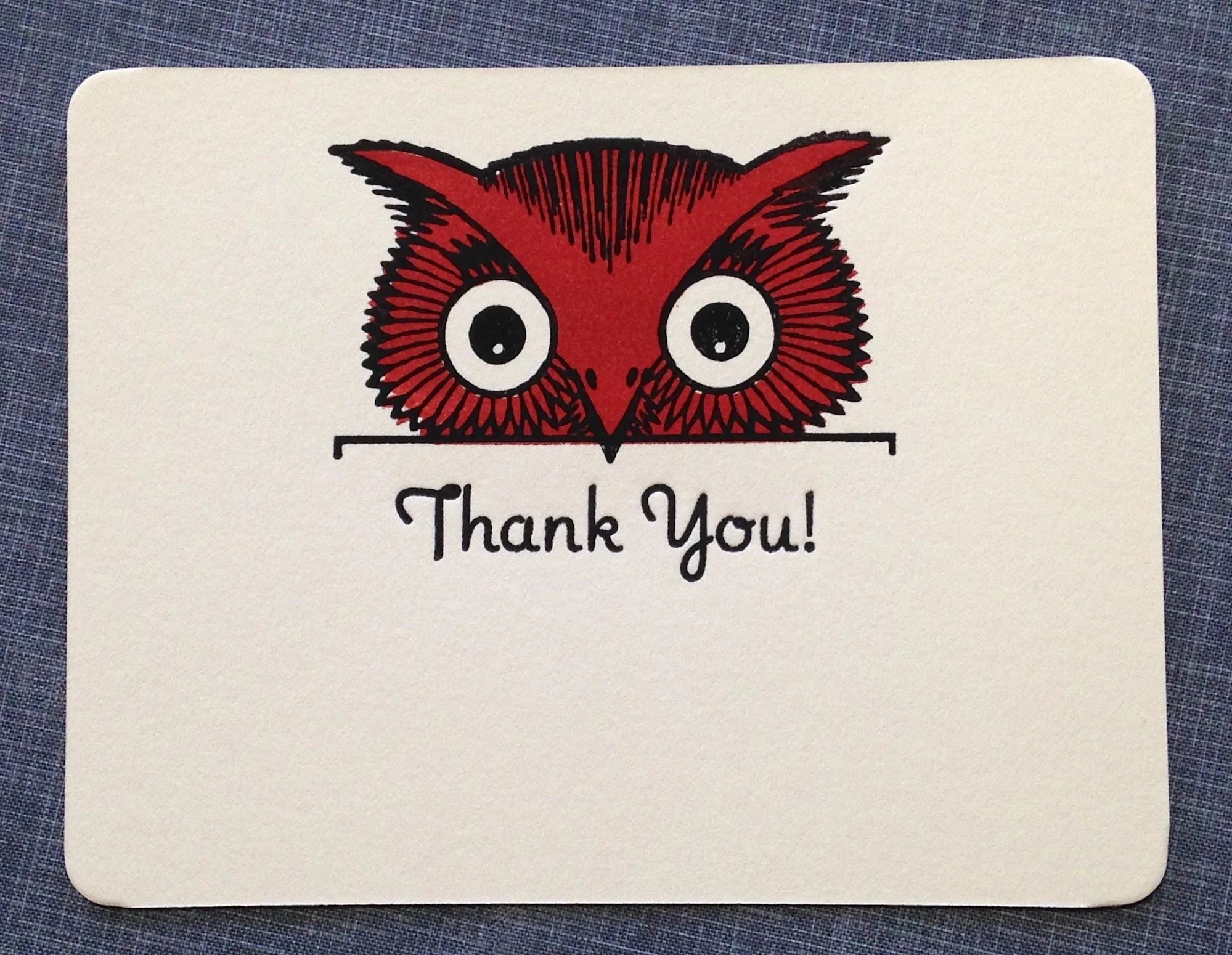 letterpress card with owl peeking over letter