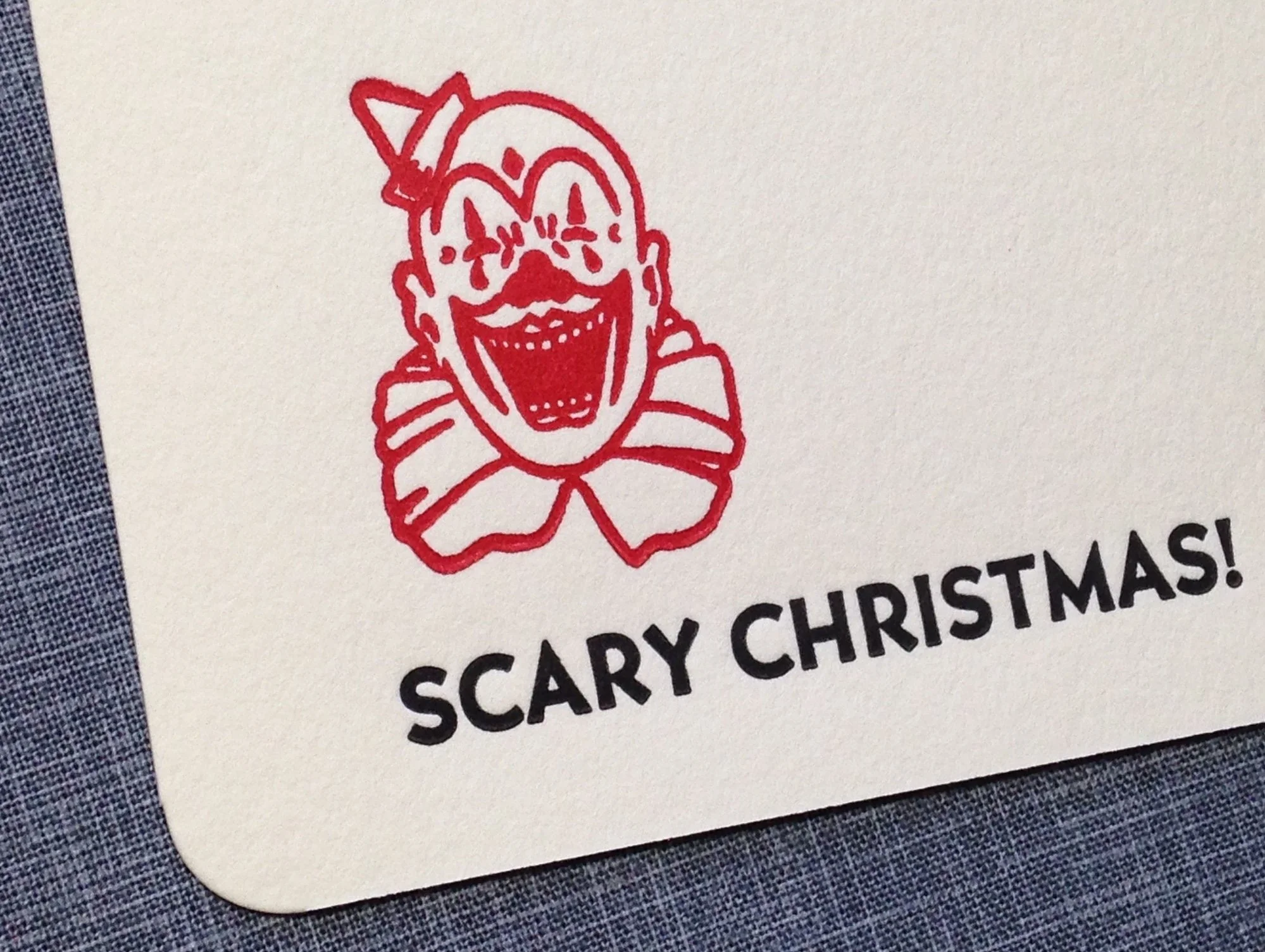 vintage advertising image of a clown on a letterpress Christmas card