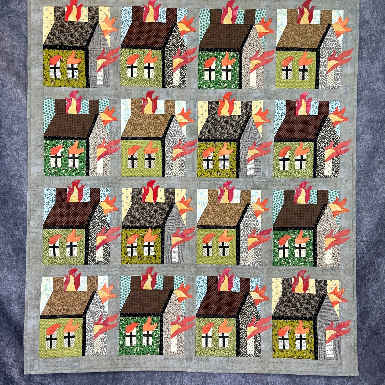 folk art quilt of houses on fire with needleturn applique