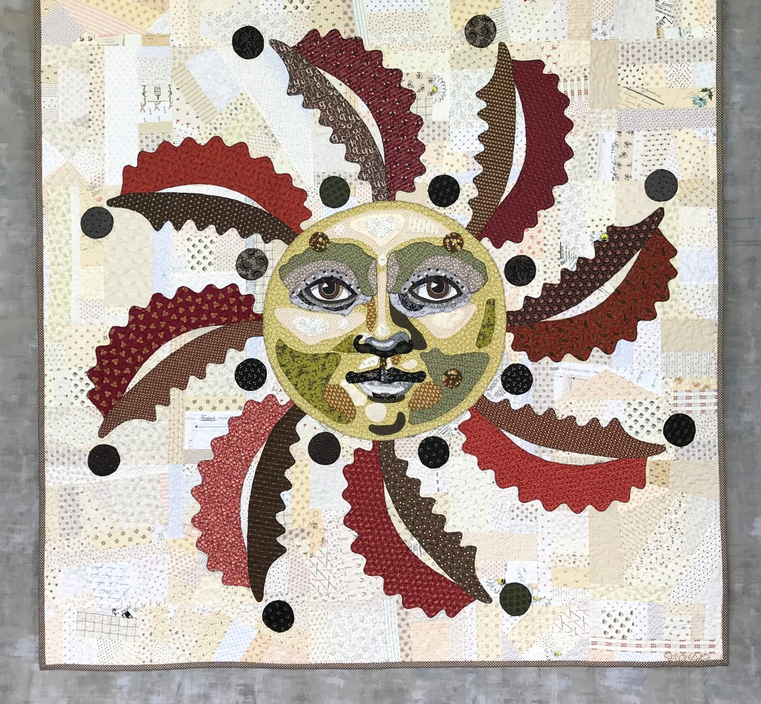 ooak folk art quilt featuring an appliqued patchwork sun and a crazy background