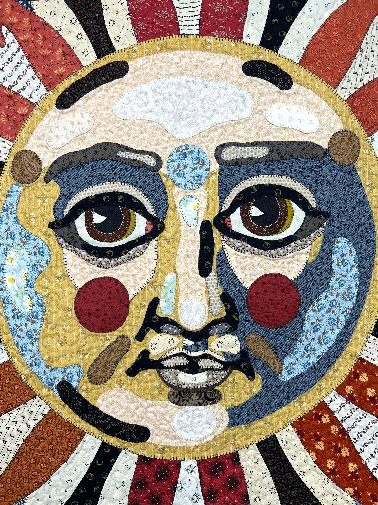 pictorial applique face quilt wall hanging