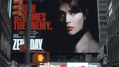 Large billboard featuring Hans Zimmerman, set in a city with tall buildings.