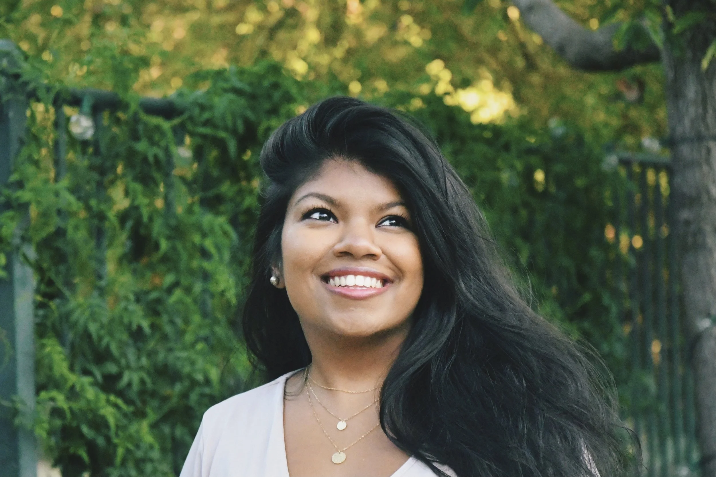 an image of Sakthi Ramesh smiling at the camera