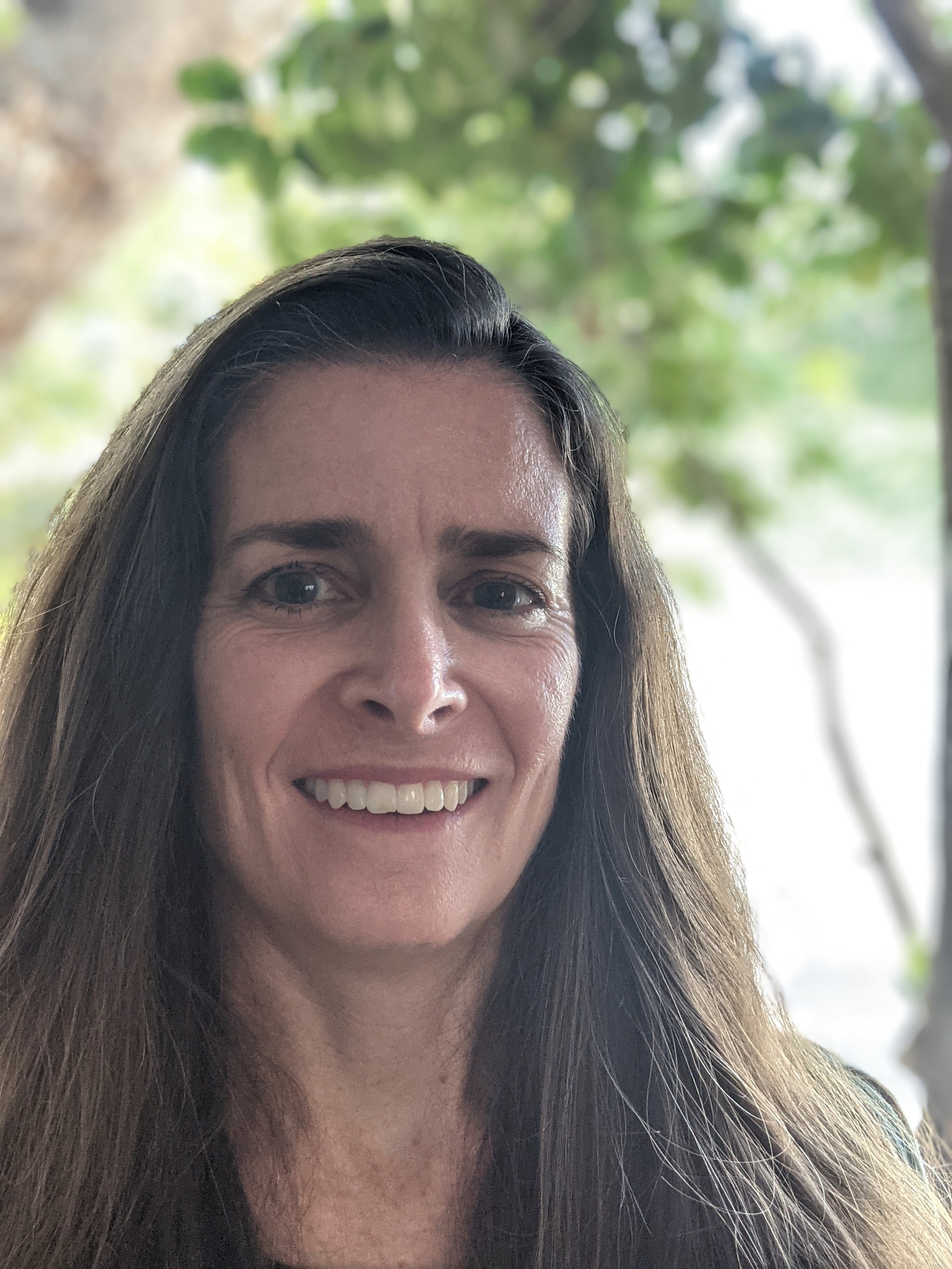 an image of Jennifer Gold smiling at the camera