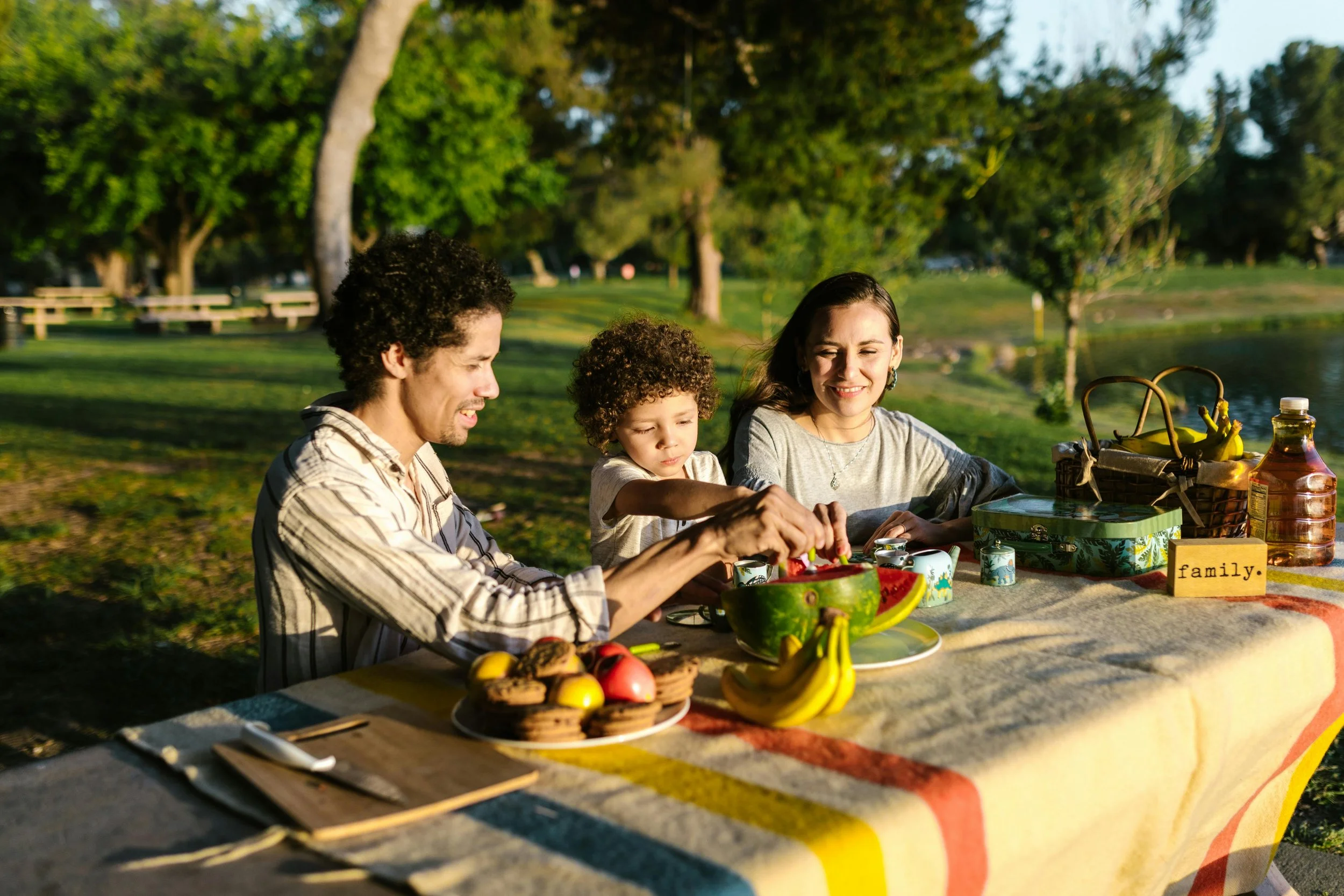 a family eating outdoors