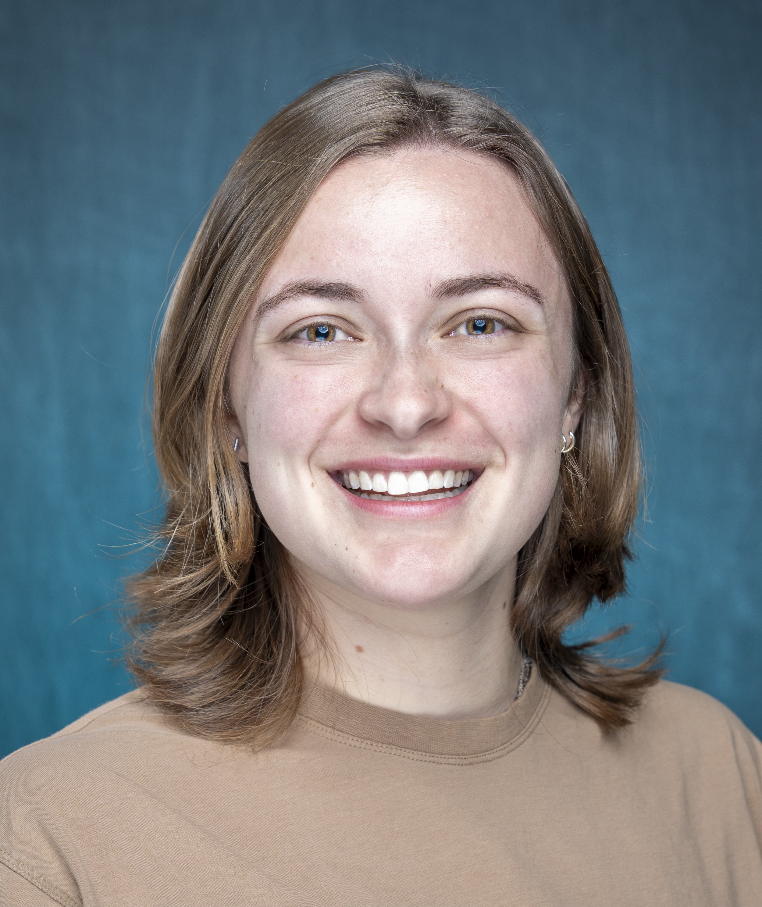 an image of Taylor Lewis smiling at the camera