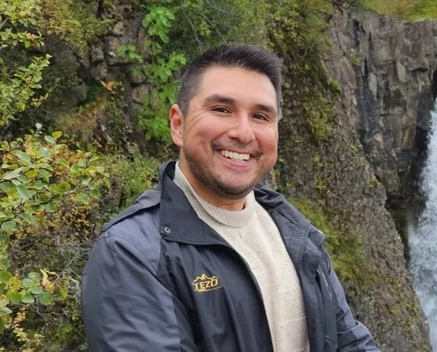 an image of Daniel Deschenes smiling at the camera