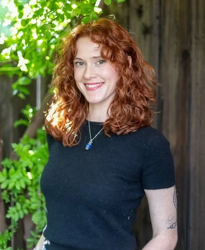 an image of Hannah Sandle smiling at the camera