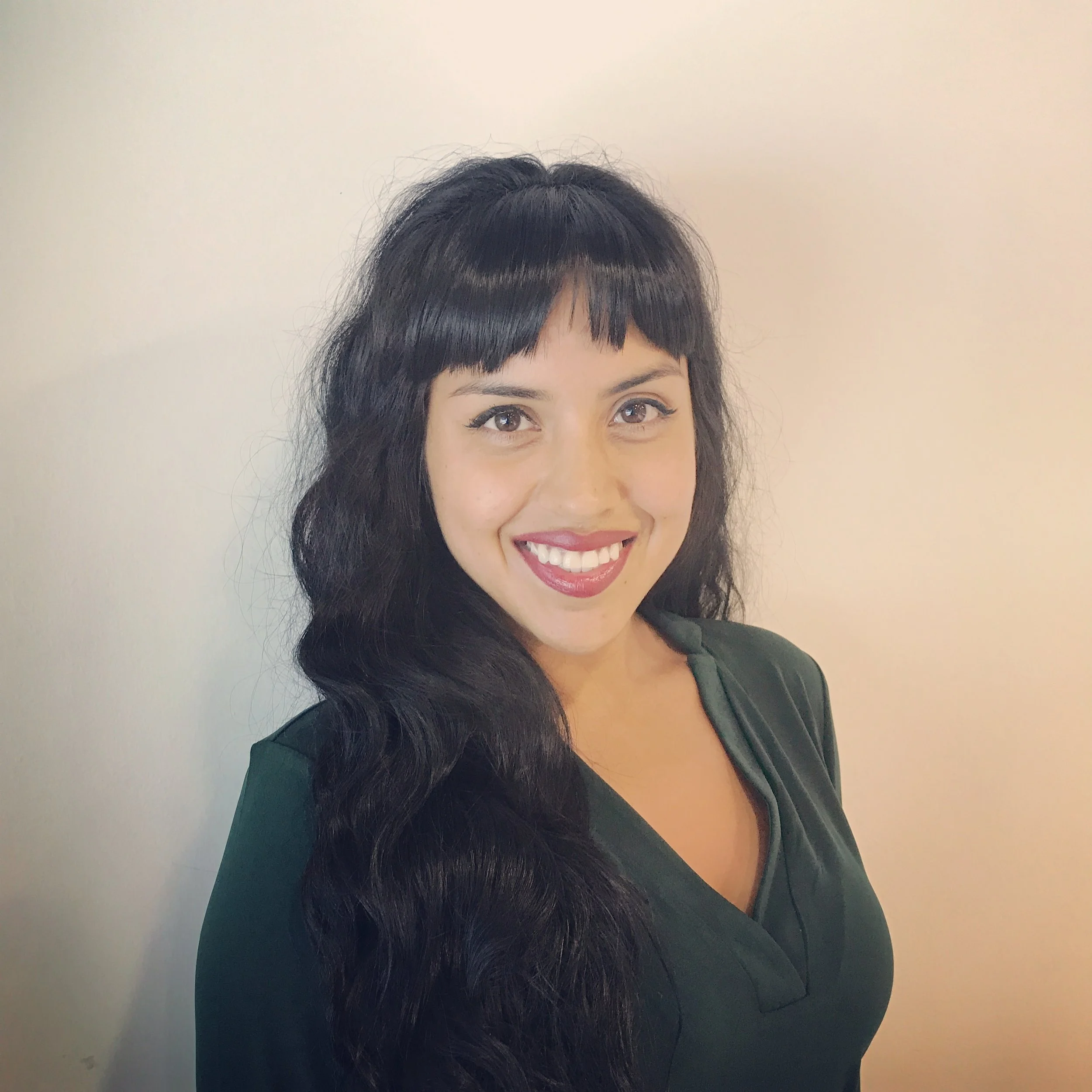 an image of Elizabeth Rodriguez smiling at the camera