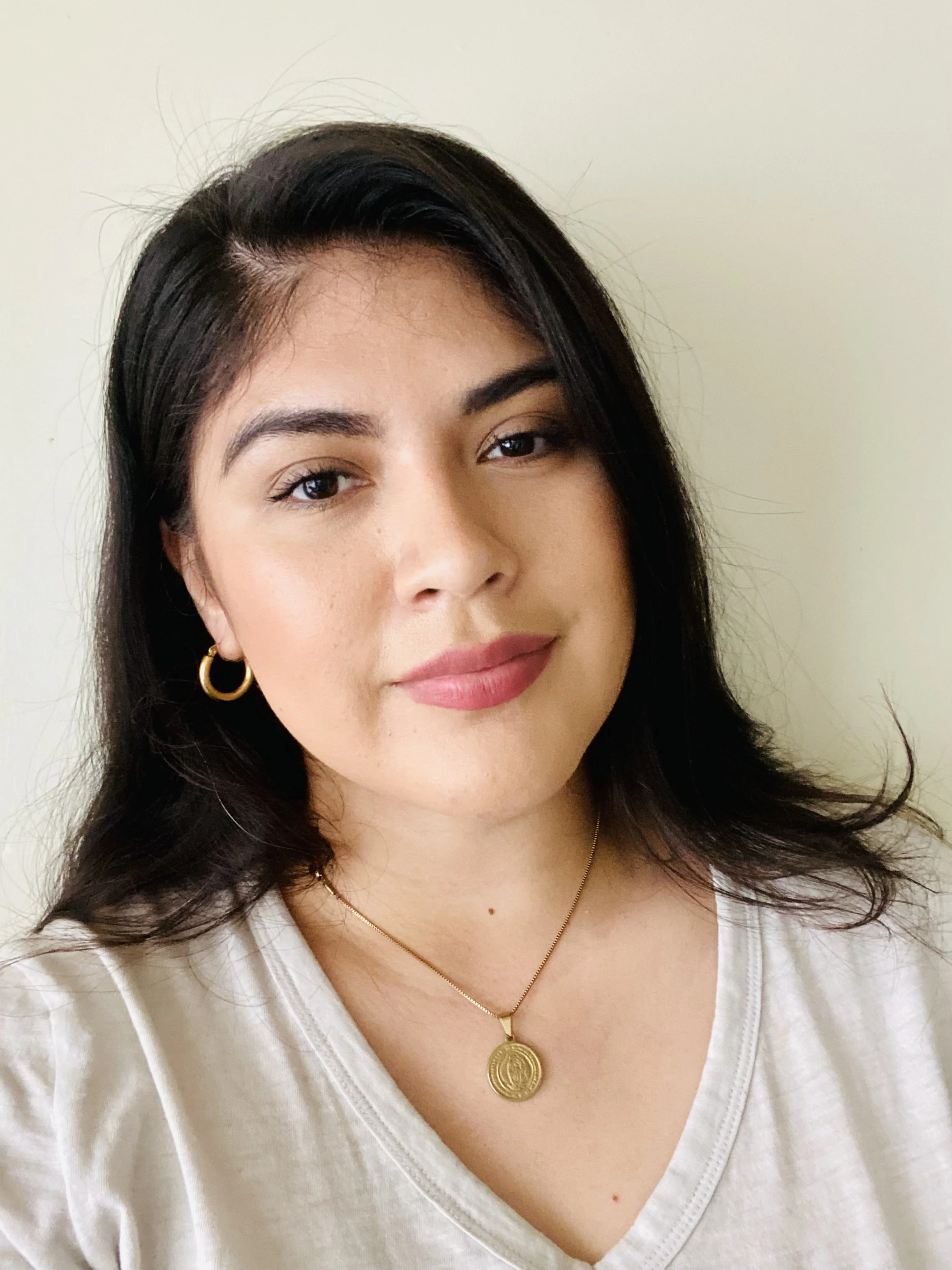 an image of Aura Cruz smiling at the camera