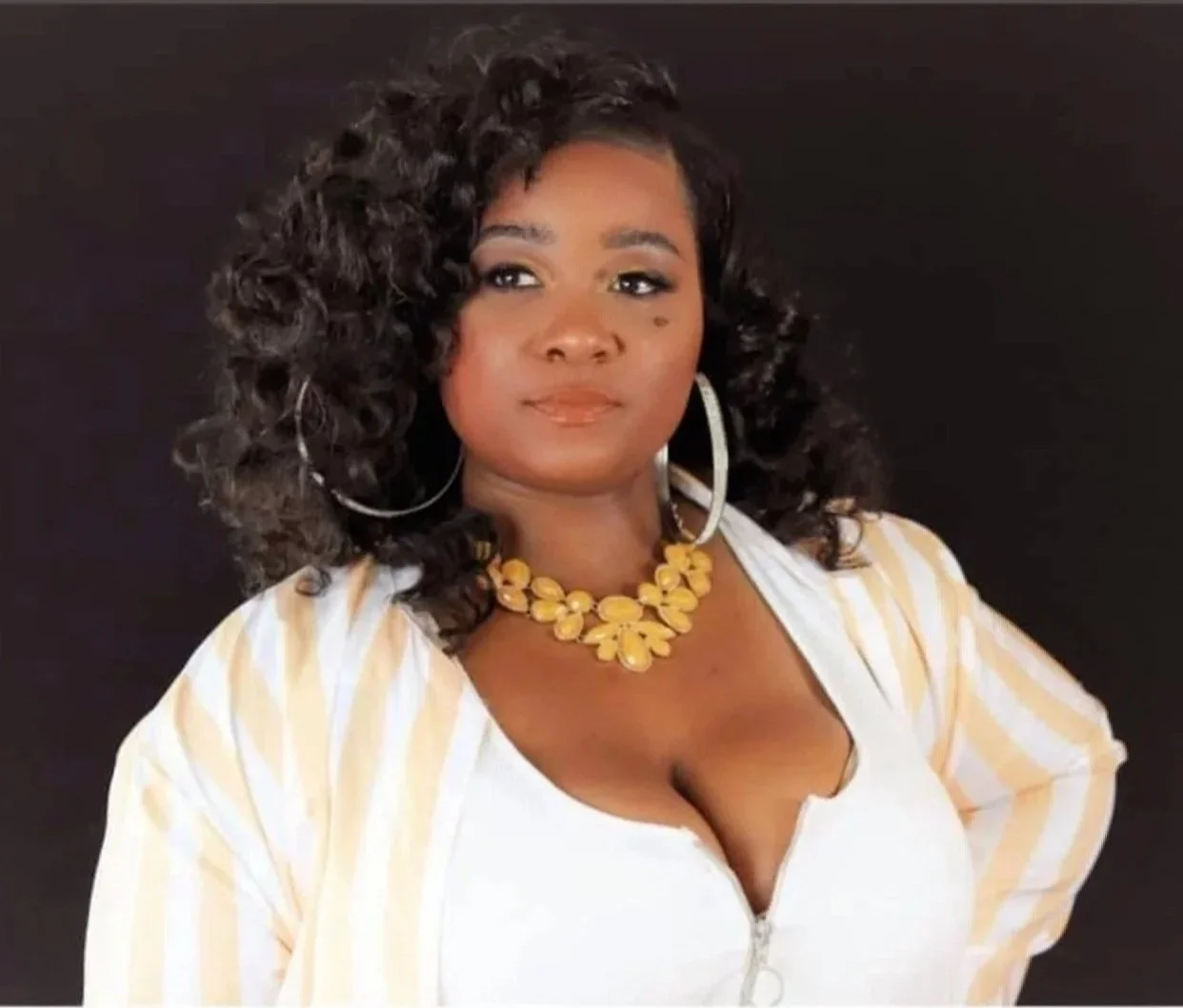 an image of Andrenique Wilson smiling at the camera