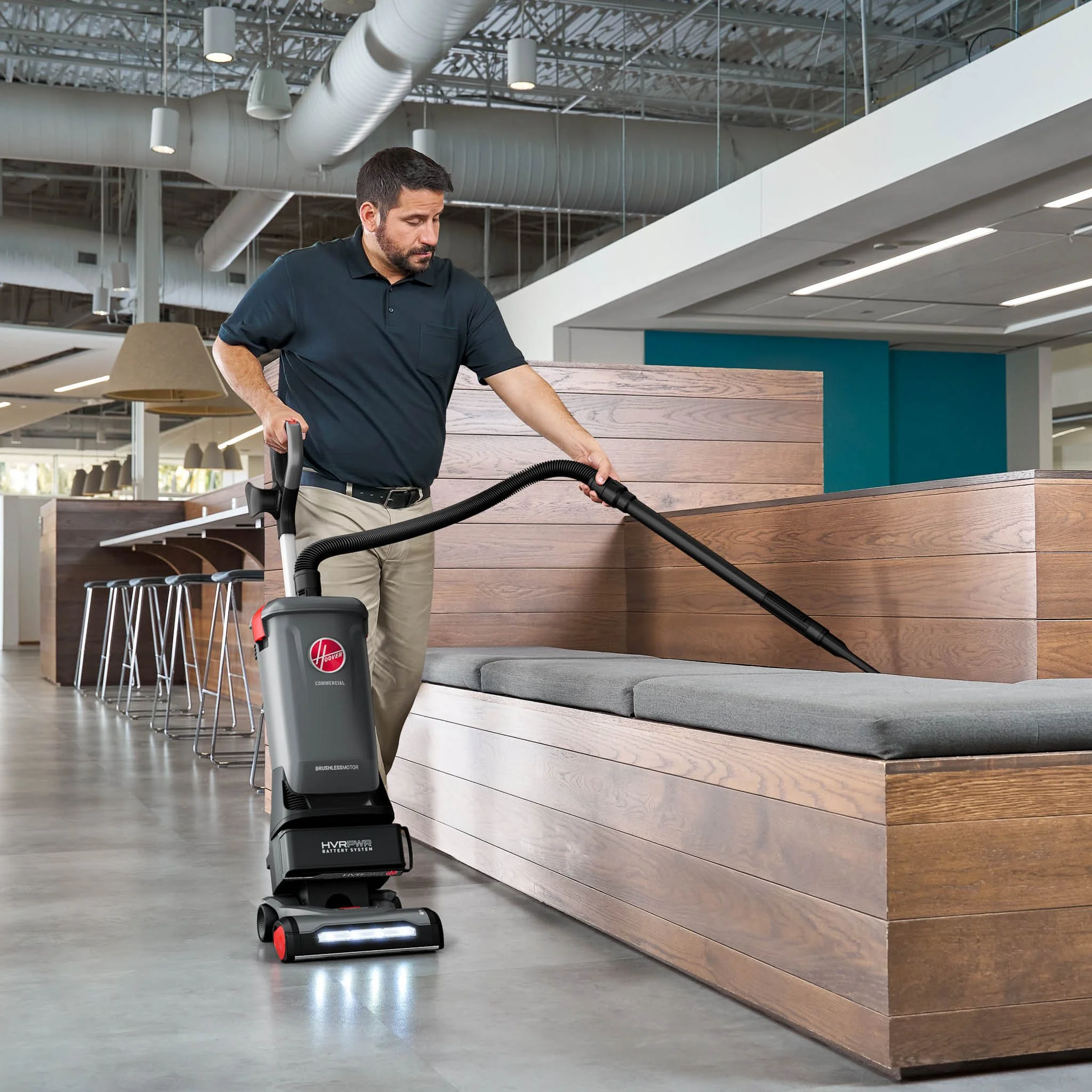 Hoover Commercial upright vacuum cleaner in a large commercial building