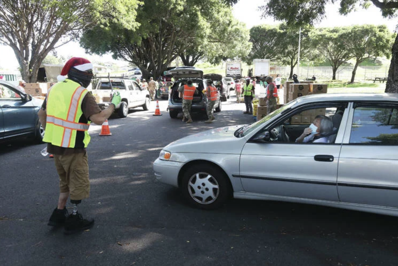 Thousands Turn Out For The Food Basket’s 100th ‘Food Drop’ Since April