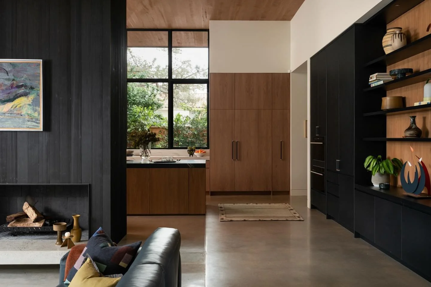 Connected spaces: a view into the kitchen at our Wilstone project with @fieldxstudio. Paired back and minimal, we combined concrete, charred black wood and oak for a warm yet streamlined material palette.

Architecture/Build: @fieldxstudio 
Interiors