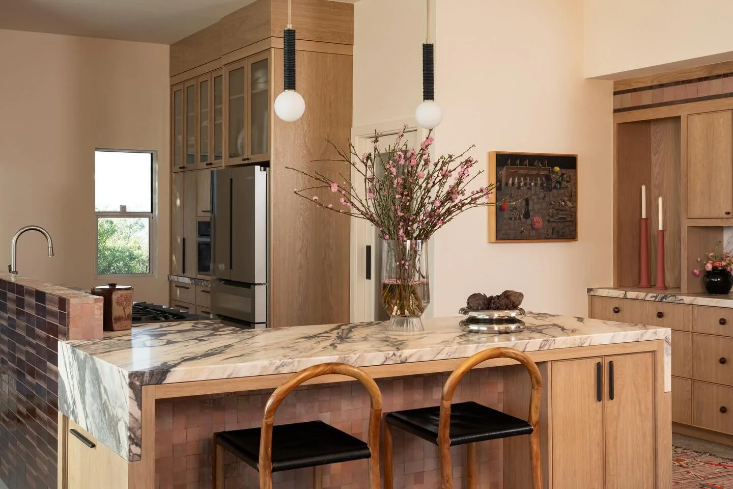 Swipe for where we started 👉🏻

Here is the full wide view of our #aNDrobley kitchen project. The renovation entailed bumping out the footprint of the kitchen and accruing space from a sunroom. The pony wall separating the kitchen from dining acts a