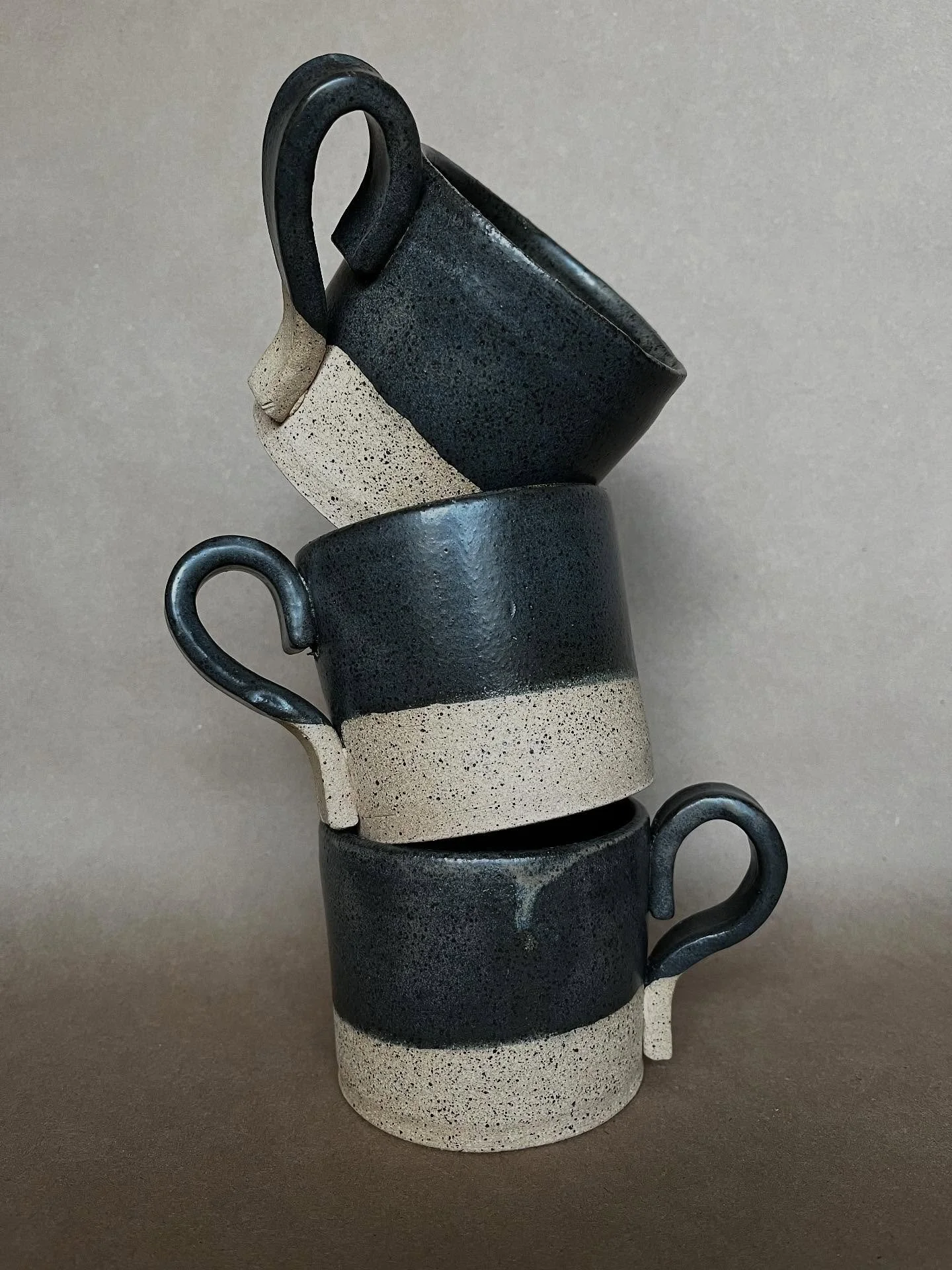 Maker Monday ✨ These mugs are fresh from the kiln&mdash;gunmetal glaze on earthy brown clay. Cups and bowls are being fired right now, which means they&rsquo;ll be added to the shop soon.

Stay Cozy 🏕️

#campnorthandco #staycozy #handmadeinwisconsin