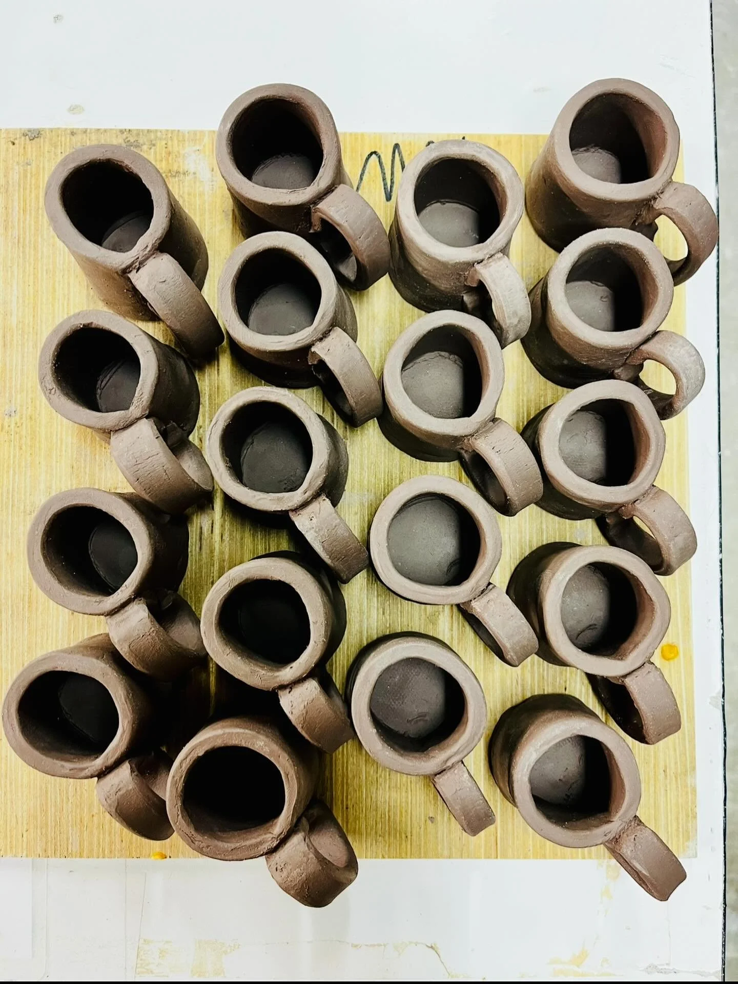 On the first day of Christmas, my studio gave to me&hellip;
Eighteen mini mugs drying carefully. 🎶☕

Next up: firing, glazing, and turning them into tiny ornaments made for cozy trees.

Stay Cozy 🏕️

#campnorthandco #staycozy #handmadeinwisconsin #