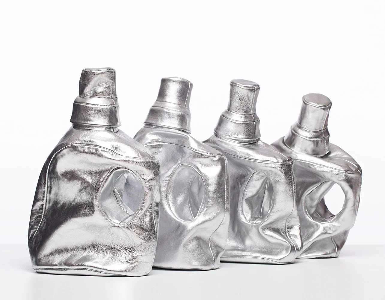 Cart No 11 Four Steel Taurus, 2015, leather mounted on white wooden shelf, 50x35x23 cm