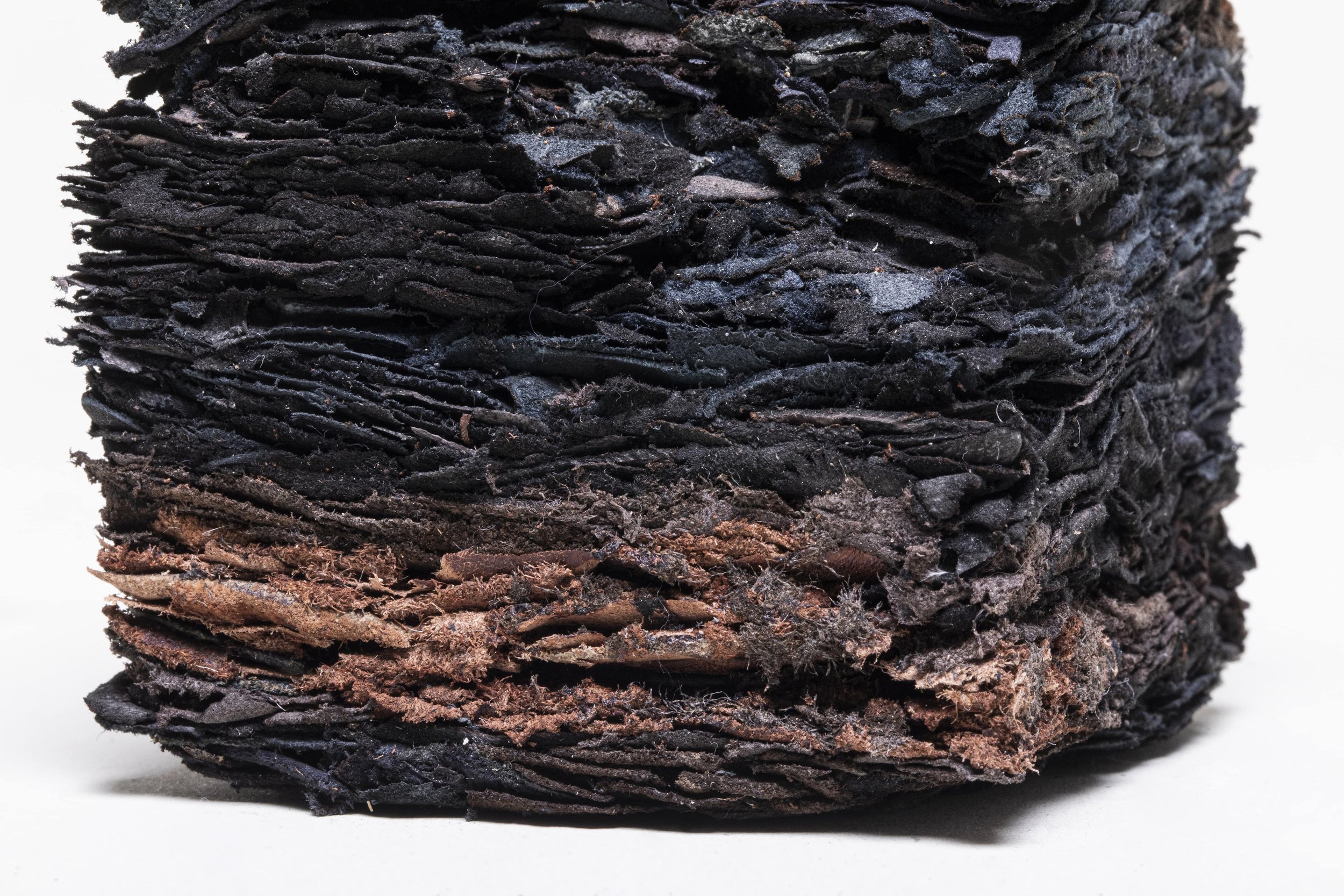 Almost completely burnt Chipboard Block (detail), 2020-2021, recycled leather, 9x7.4x7.4 cm