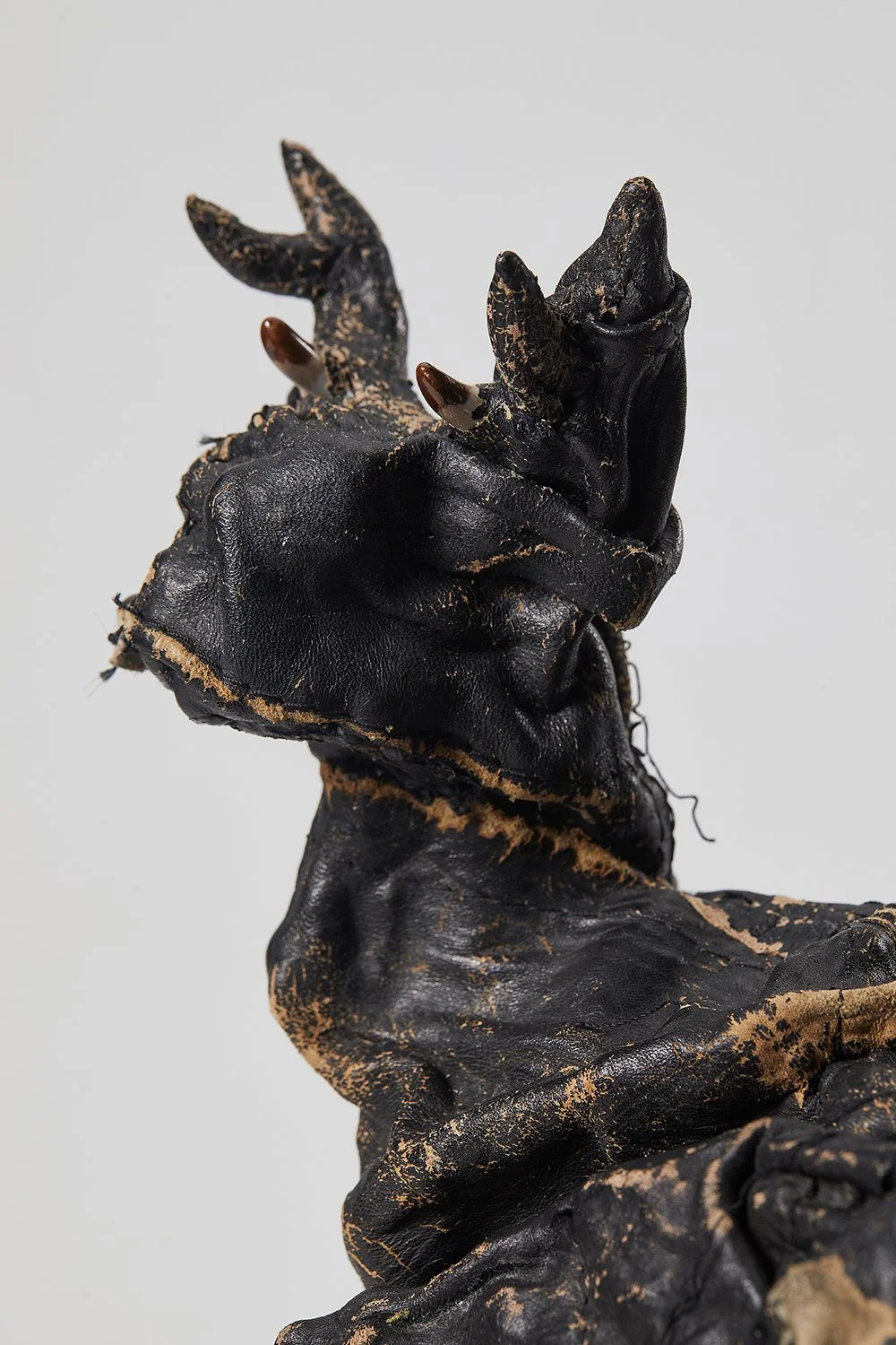 Pair of Deer (detail), 2025, recycled leather over vintage porcelain statue, 18x26.4x12.3 cm