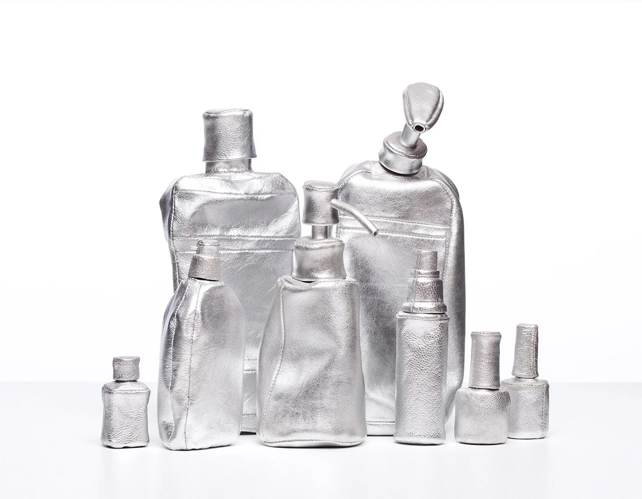 Cart No 13  Intense Day Care, 2015, leather mounted on white wooden shelf, 50x29x13 cm