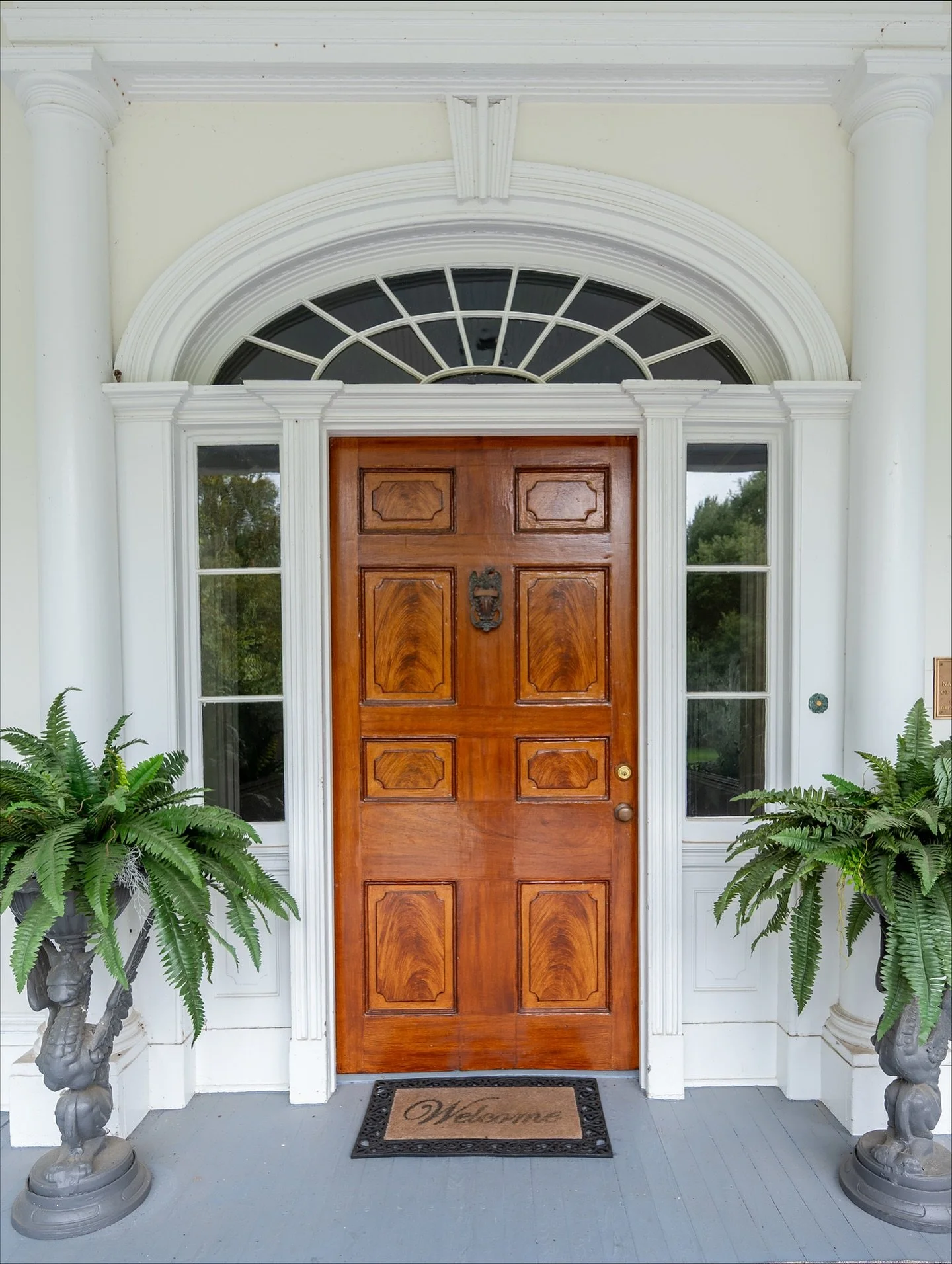 The three front doors of The Briars were the very first project we began&mdash;even before painting the exterior! Their panels feature a faux bois finish, a decorative technique where paint is skillfully used to imitate the look of high-quality (ofte