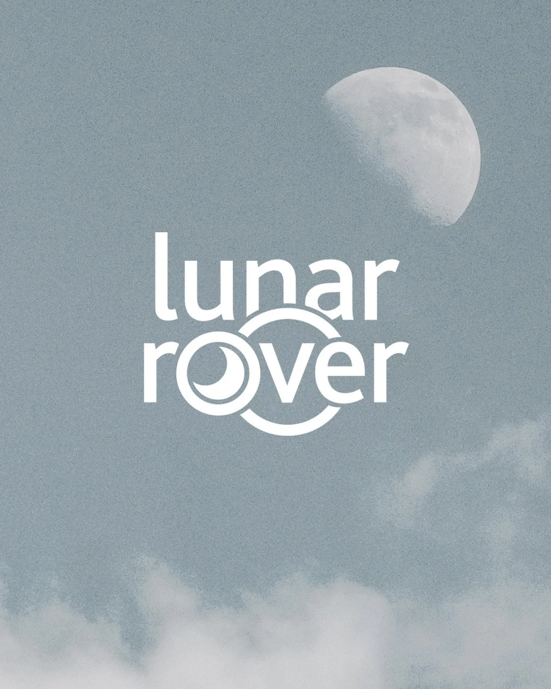 A semi-full moon in the sky with clouds, and a stylized logo for Lunar Rover.