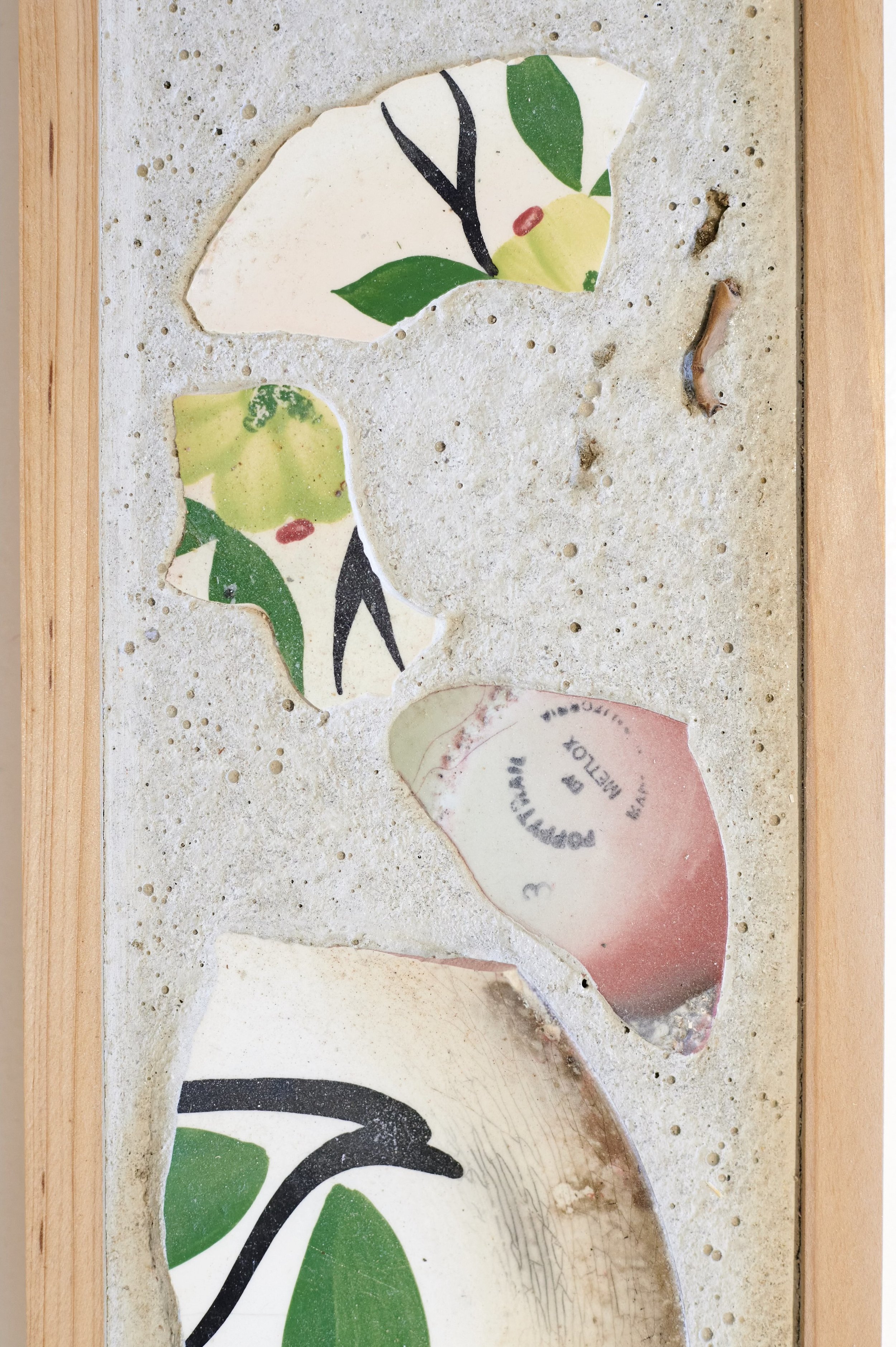 Family Heirlooms (detail), 2025. Salvaged tile, ceramic shards, concrete, wood.