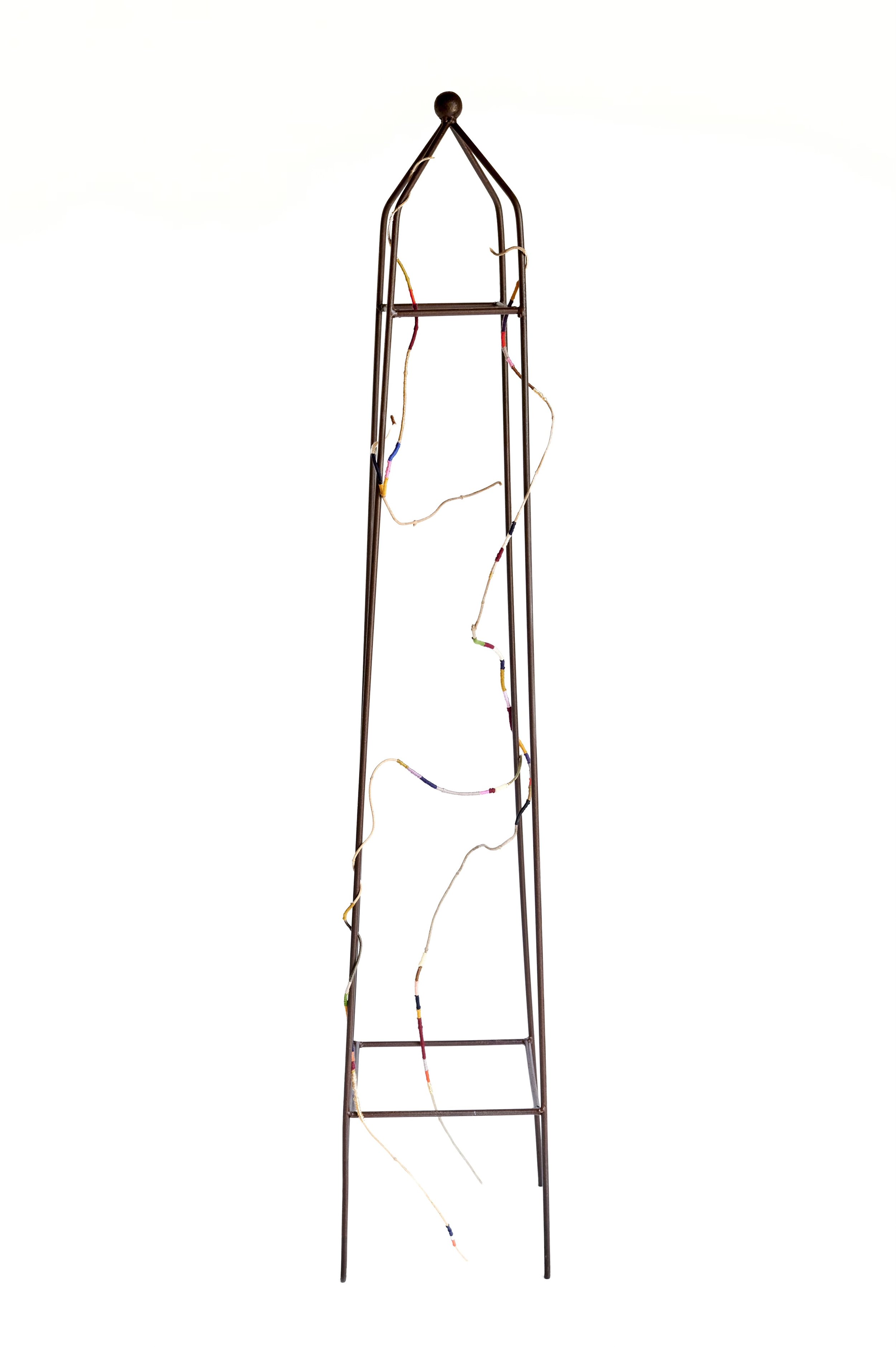 Pyriscence, 2026. Salvaged trellis, vine, wire, embroidery floss.