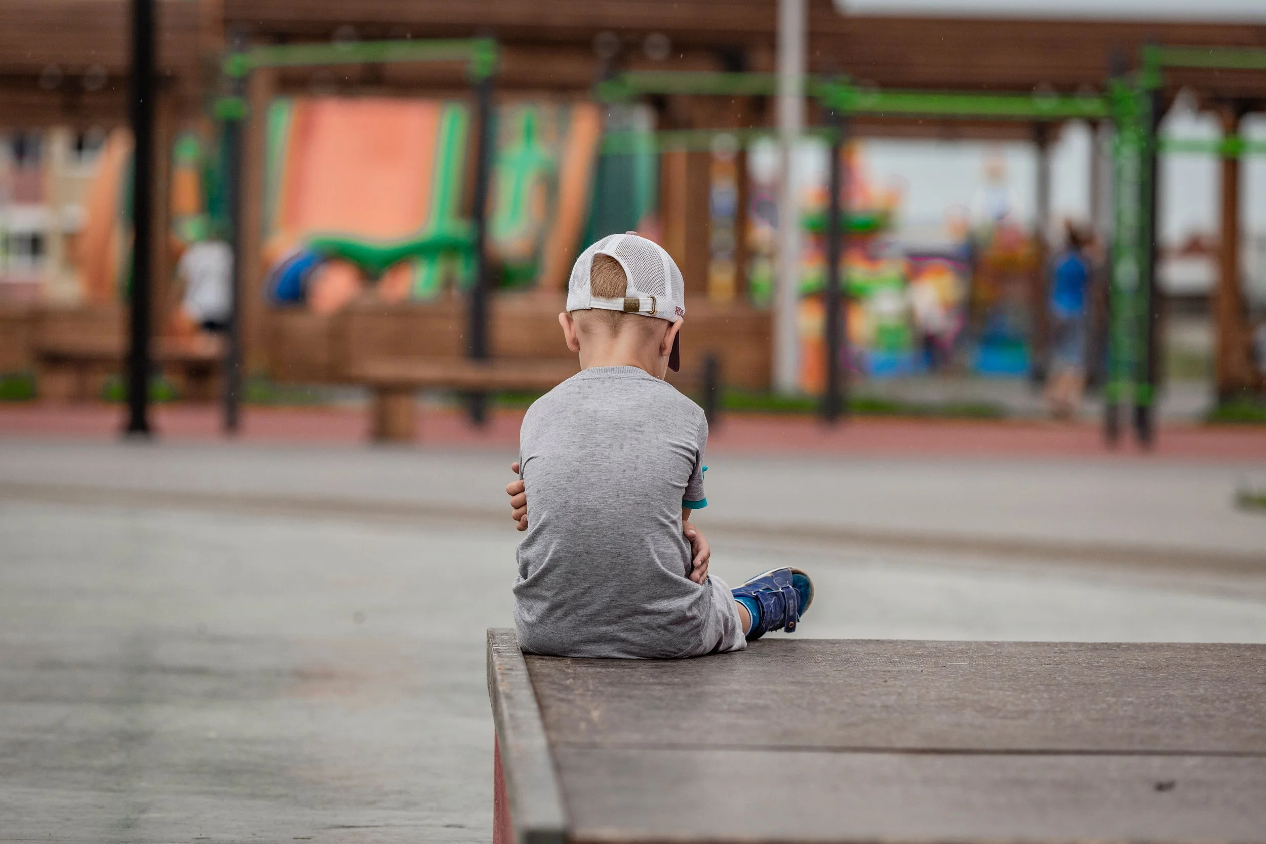 A lonely child on the playground