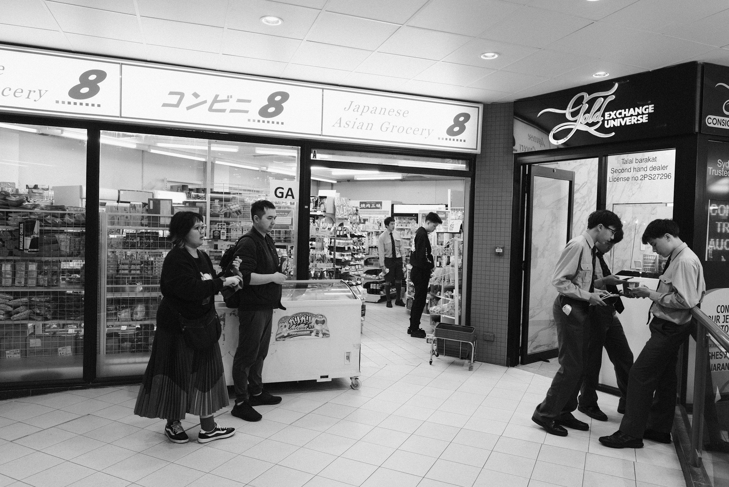 People shopping at a convenience store