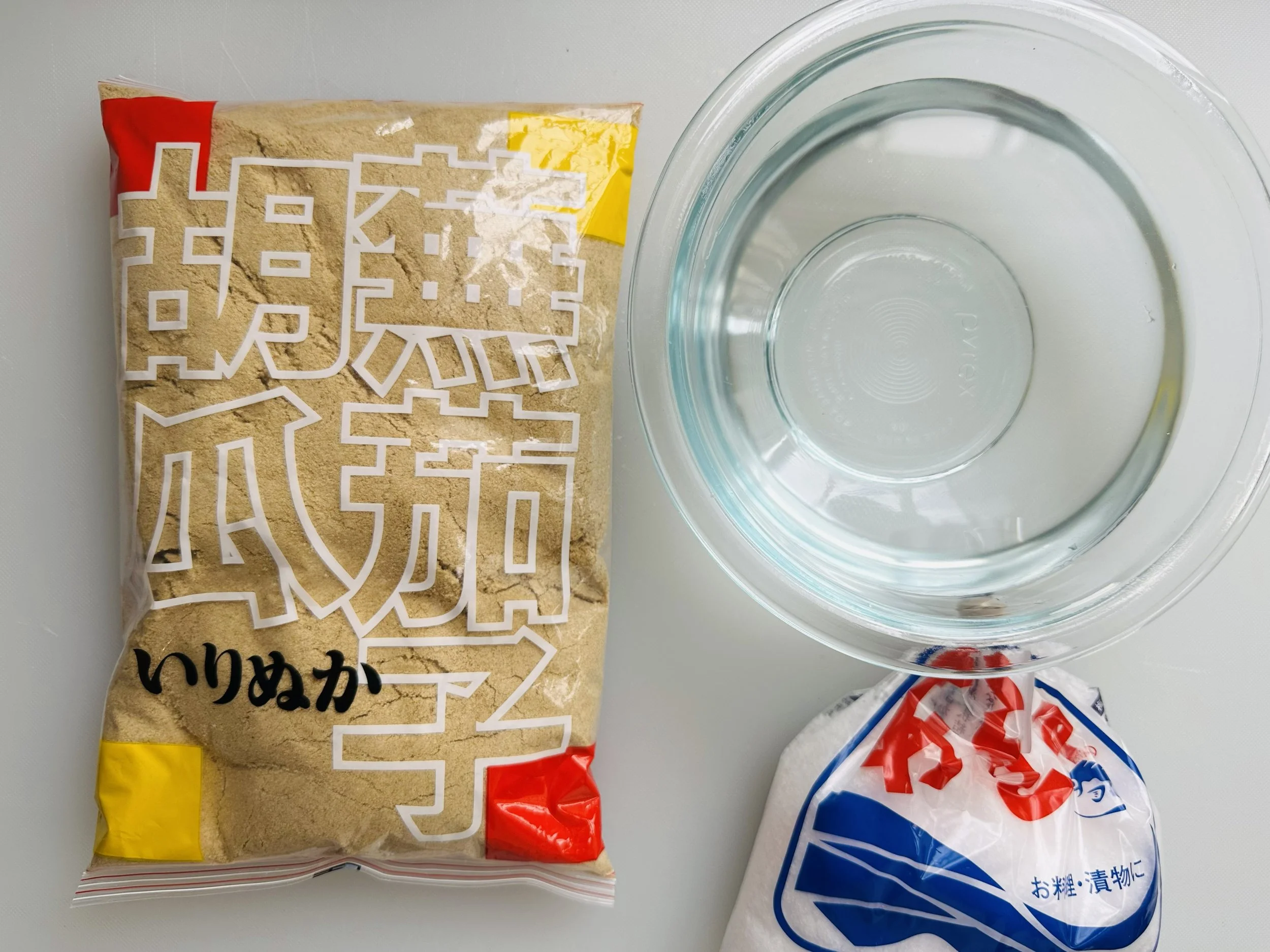 Nukadoko ingredients, including bran, salt and a bowl.
