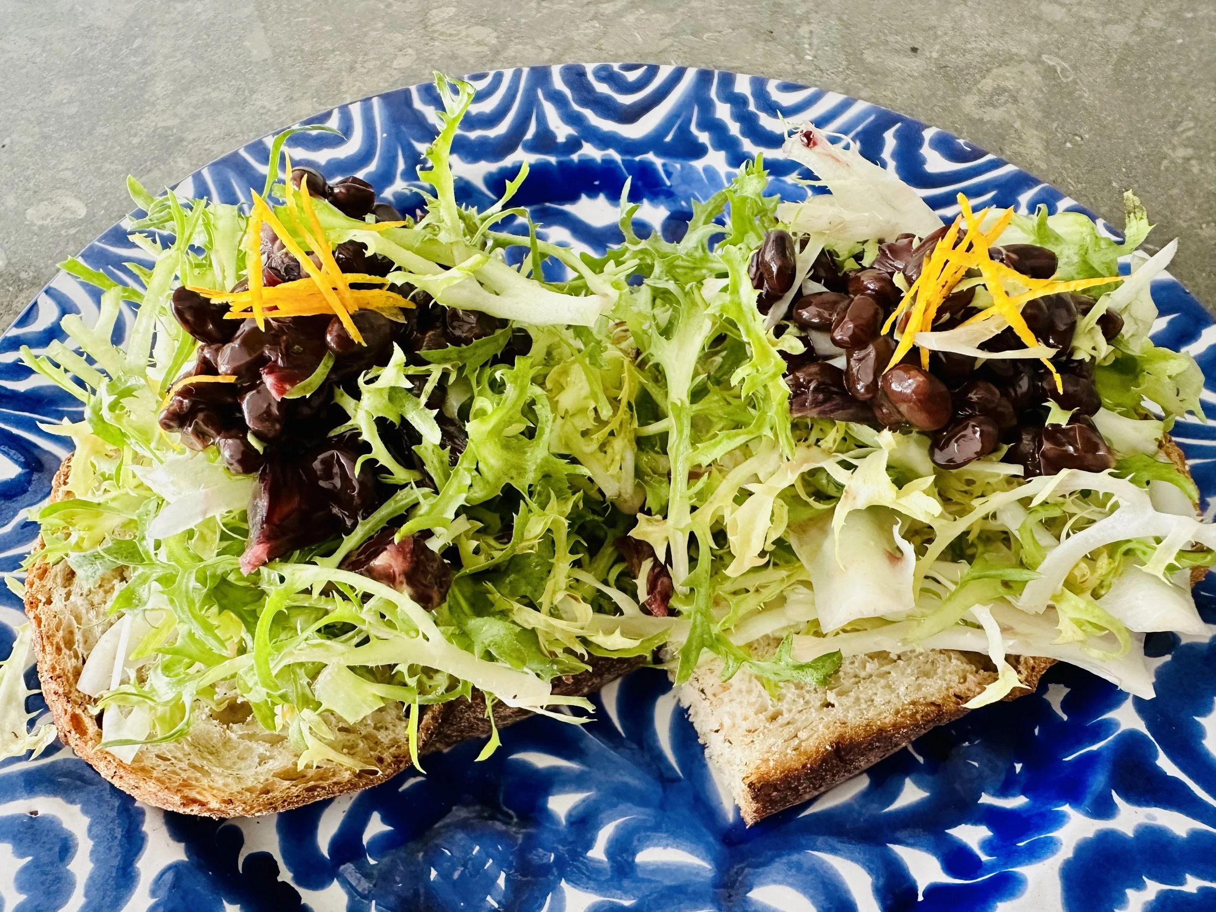 Natto topped on an open face sandwich
