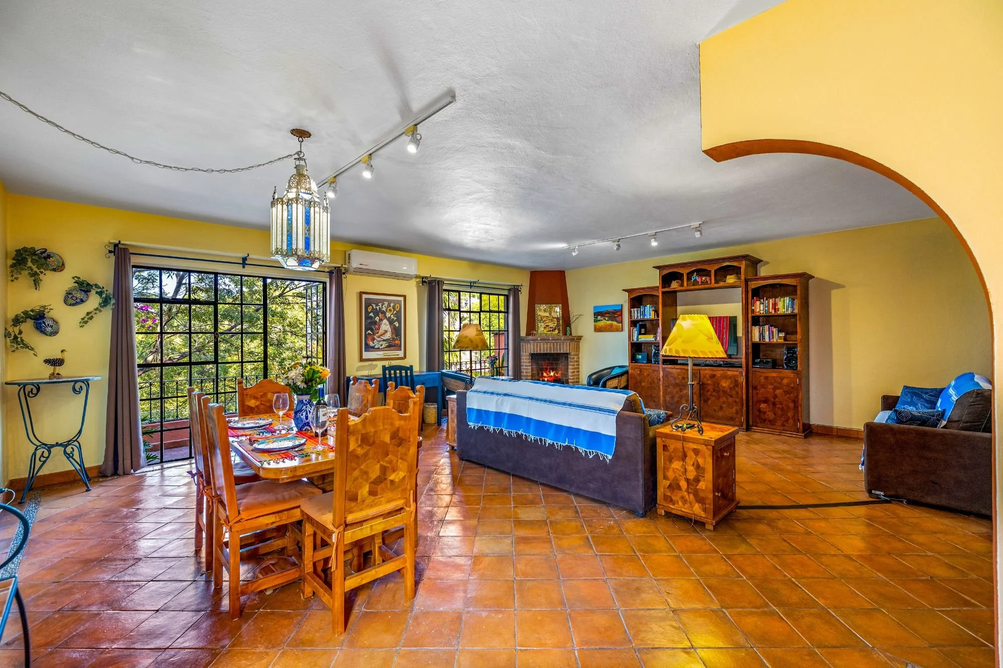 6. Open-concept living and dining area with terrace access