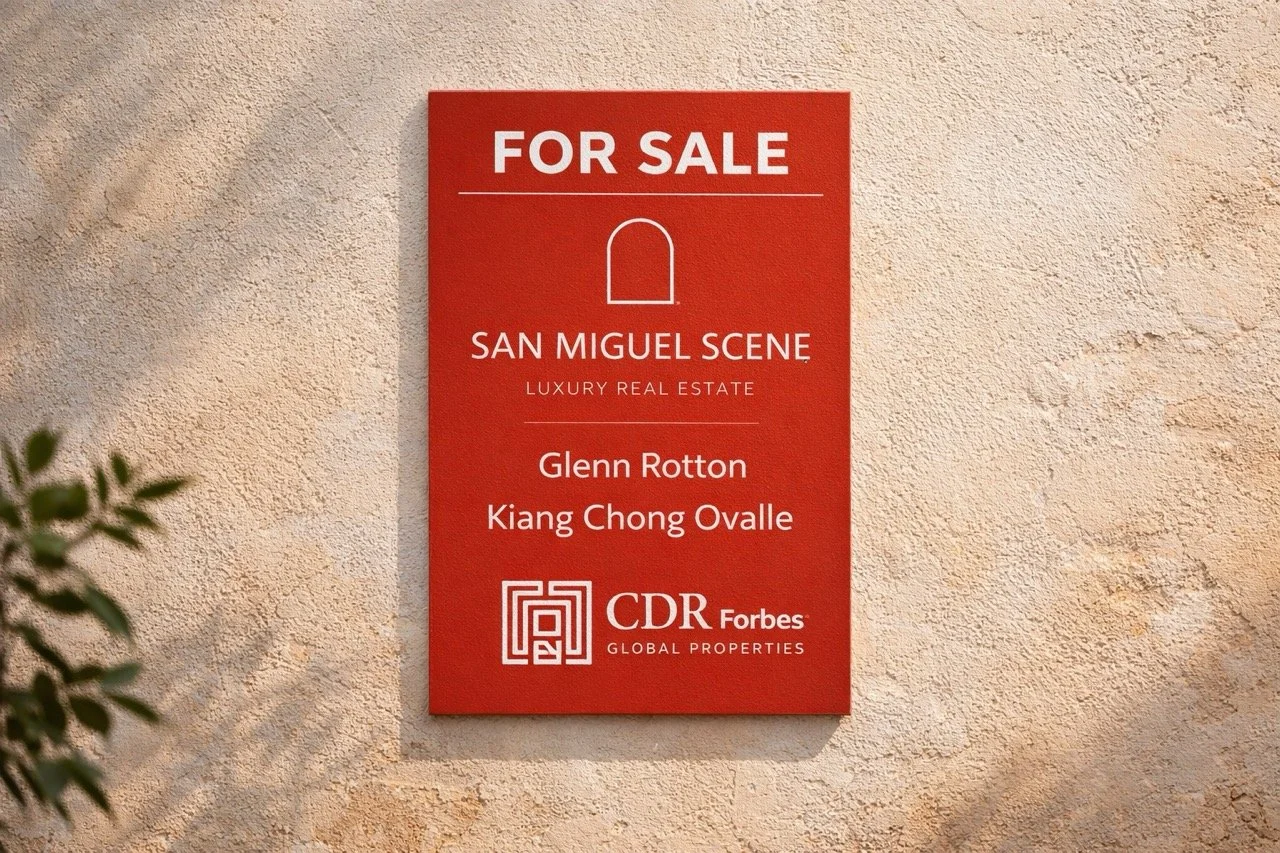 San Miguel Scene for sale sign on a stucco wall in San Miguel de Allende