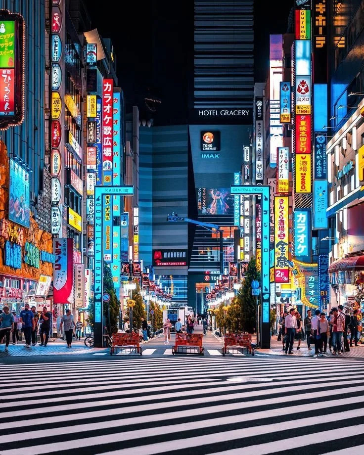 bright city lights in a lively district at night in tokyo japan