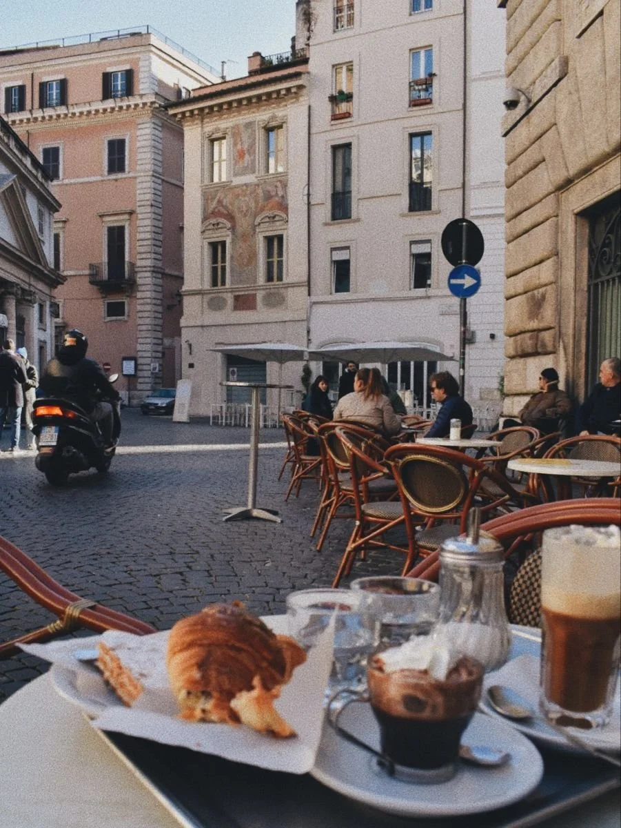 Cafe on a bustling street in Rome, Italy.