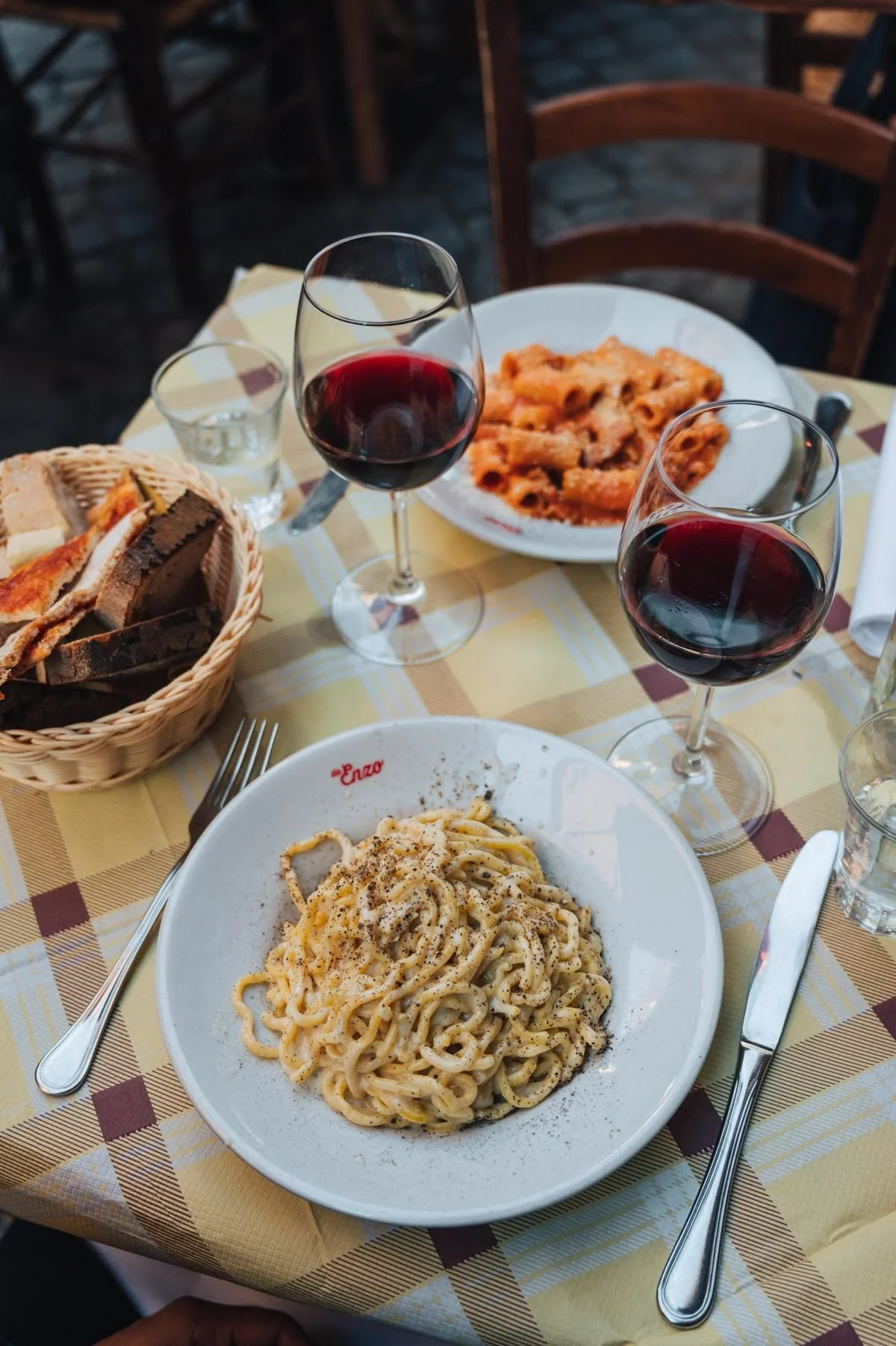 Pasta lunch carbonara and wine in Rome, Italy Cacio e pepe