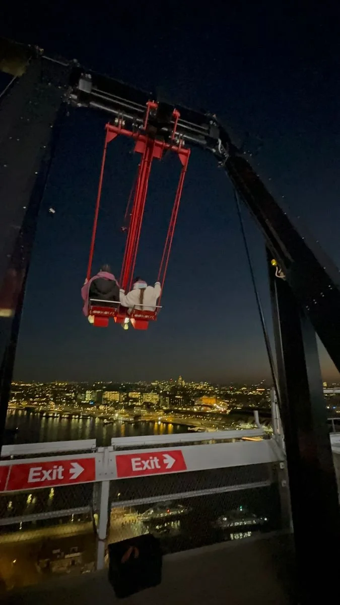 "over the edge" swing at the A'DAM Lookout at night in Amsterdam, Netherlands