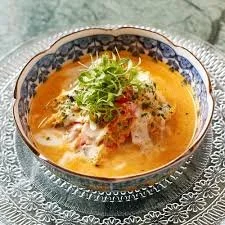 iconic dish at Michelin restaurant candlenut in Singapore