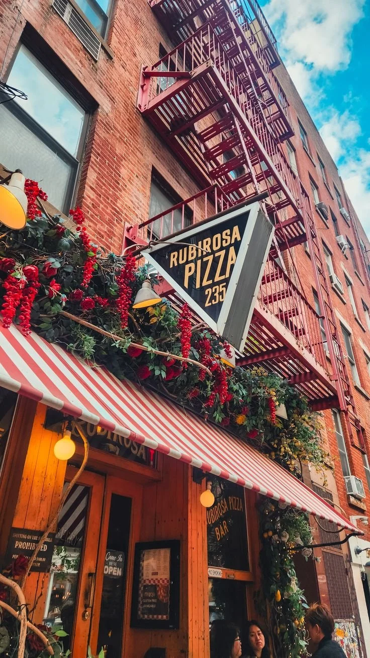 Outside view of Rubirosa pizza restaurant in NYC aesthetic brick wall