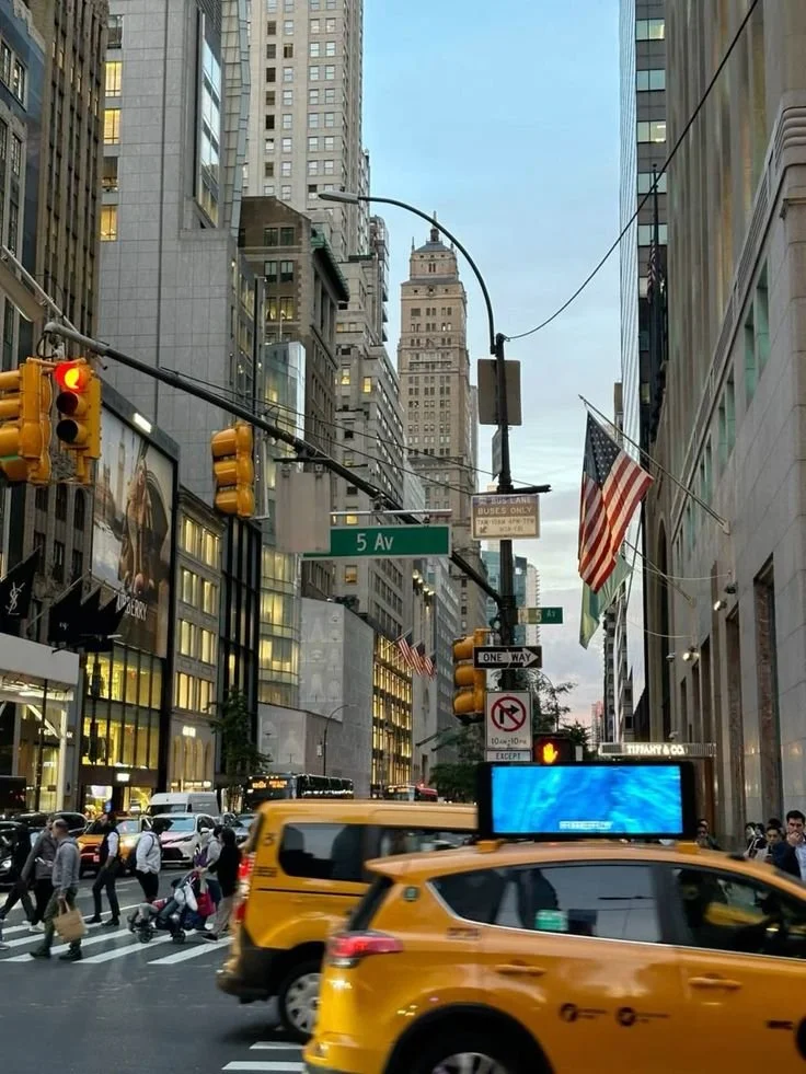 New York City street with taxi's and american flags