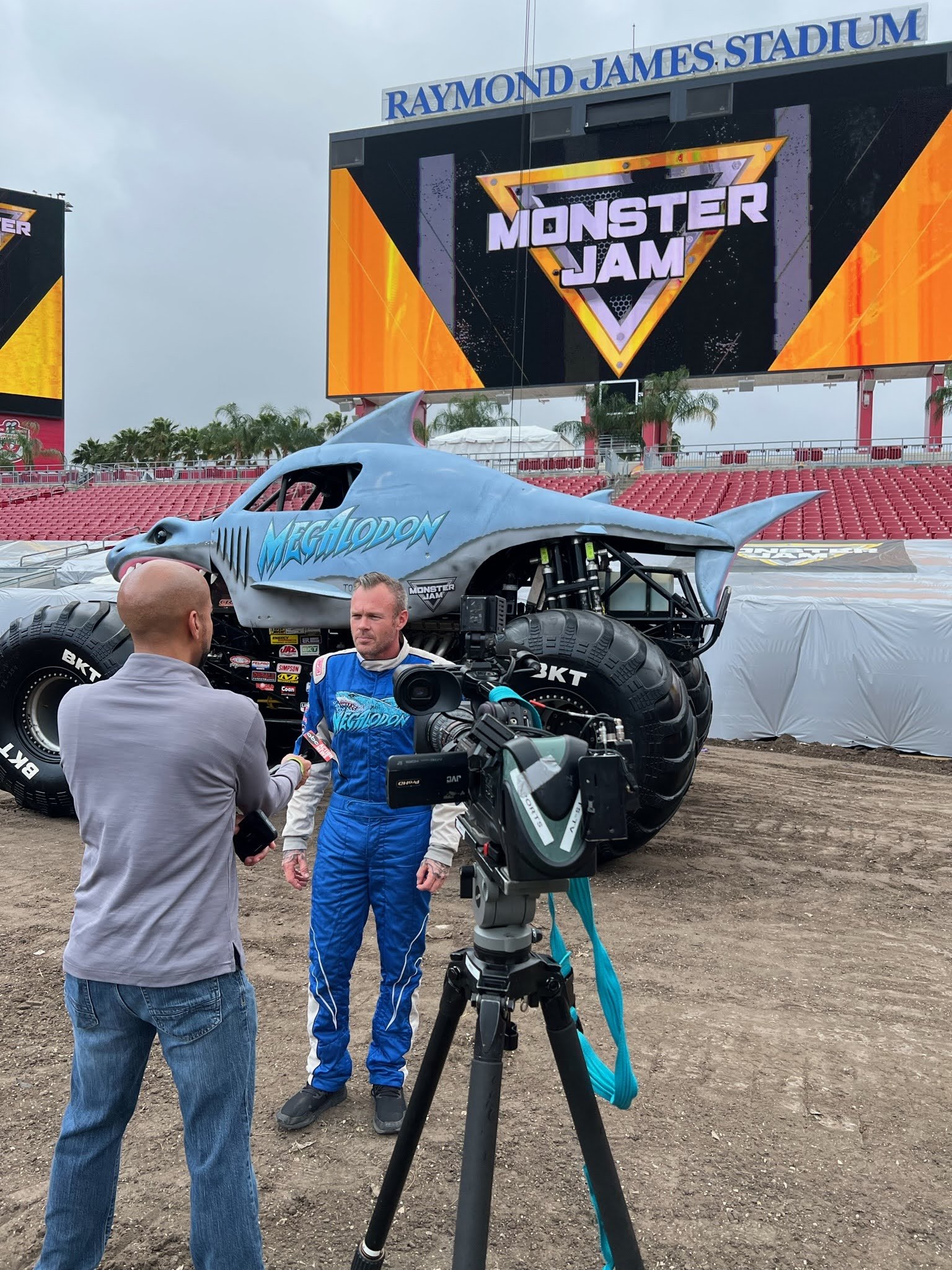 Crackerjack Media public relations at Raymond James Stadium in Tampa — TV interview with Megalodon monster truck driver before Monster Jam.
