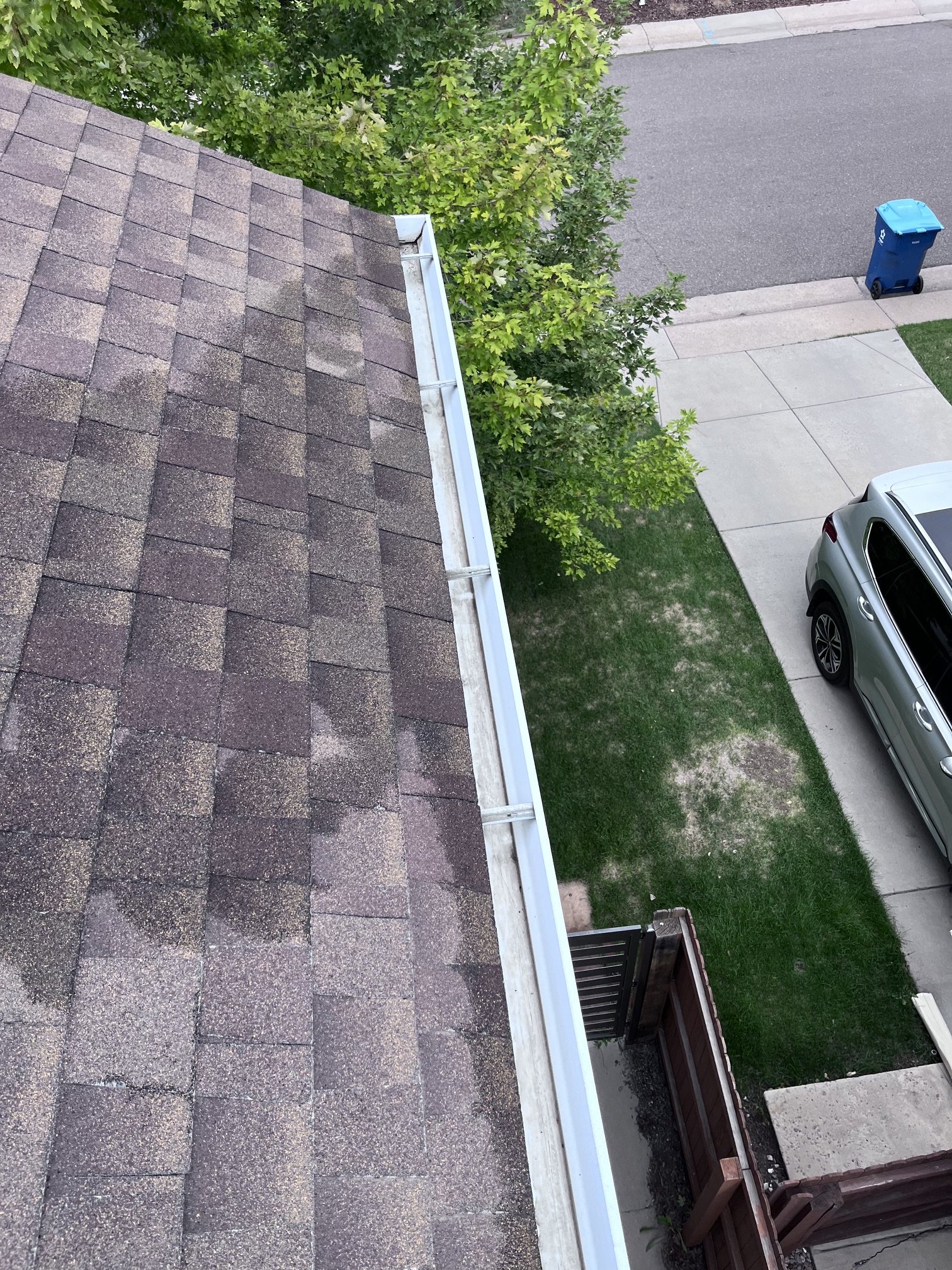 Existing 5-inch gutter after leaves and accumulated debris were removed during gutter cleaning in Holly Hills, Denver.